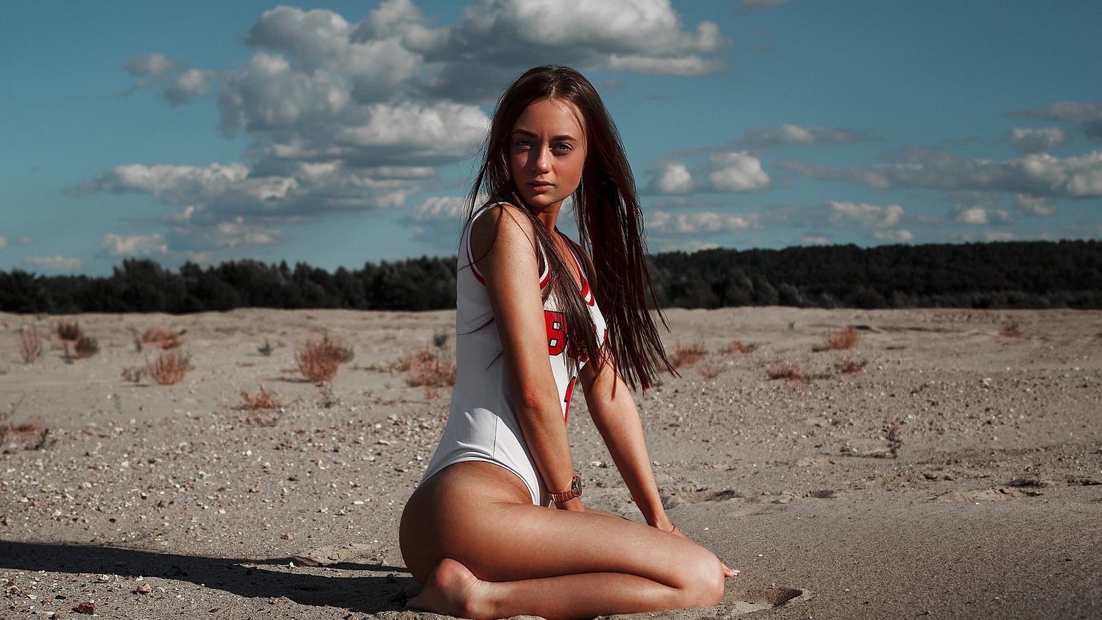 women, one-piece swimsuit, kneeling, tanned, tan lines, sand, long hair, women outdoors