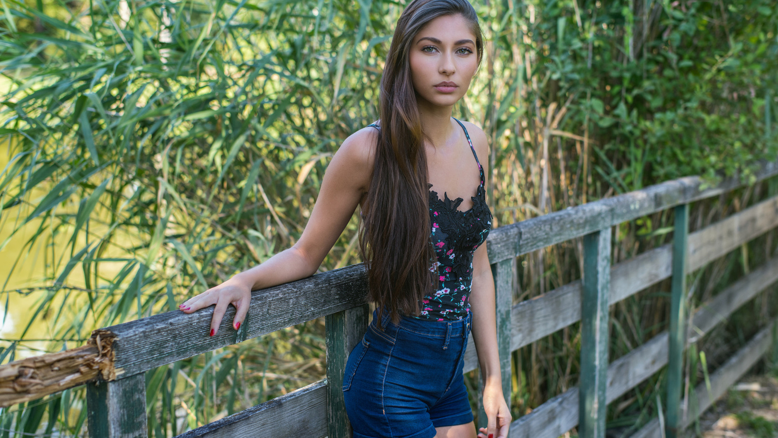 women, portrait, fence, long hair, jean shorts, red nails