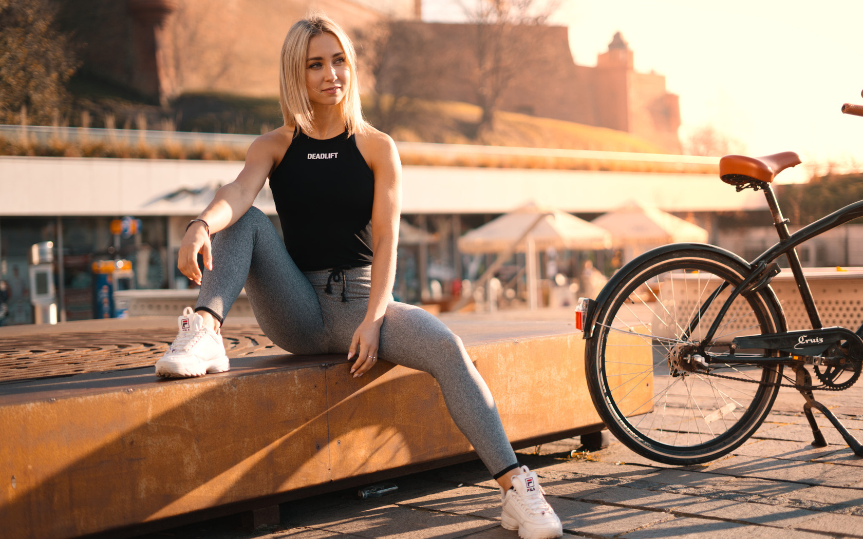 women, blonde, sitting, bicycle, sportswear, sneakers, women outdoors, smiling, fila