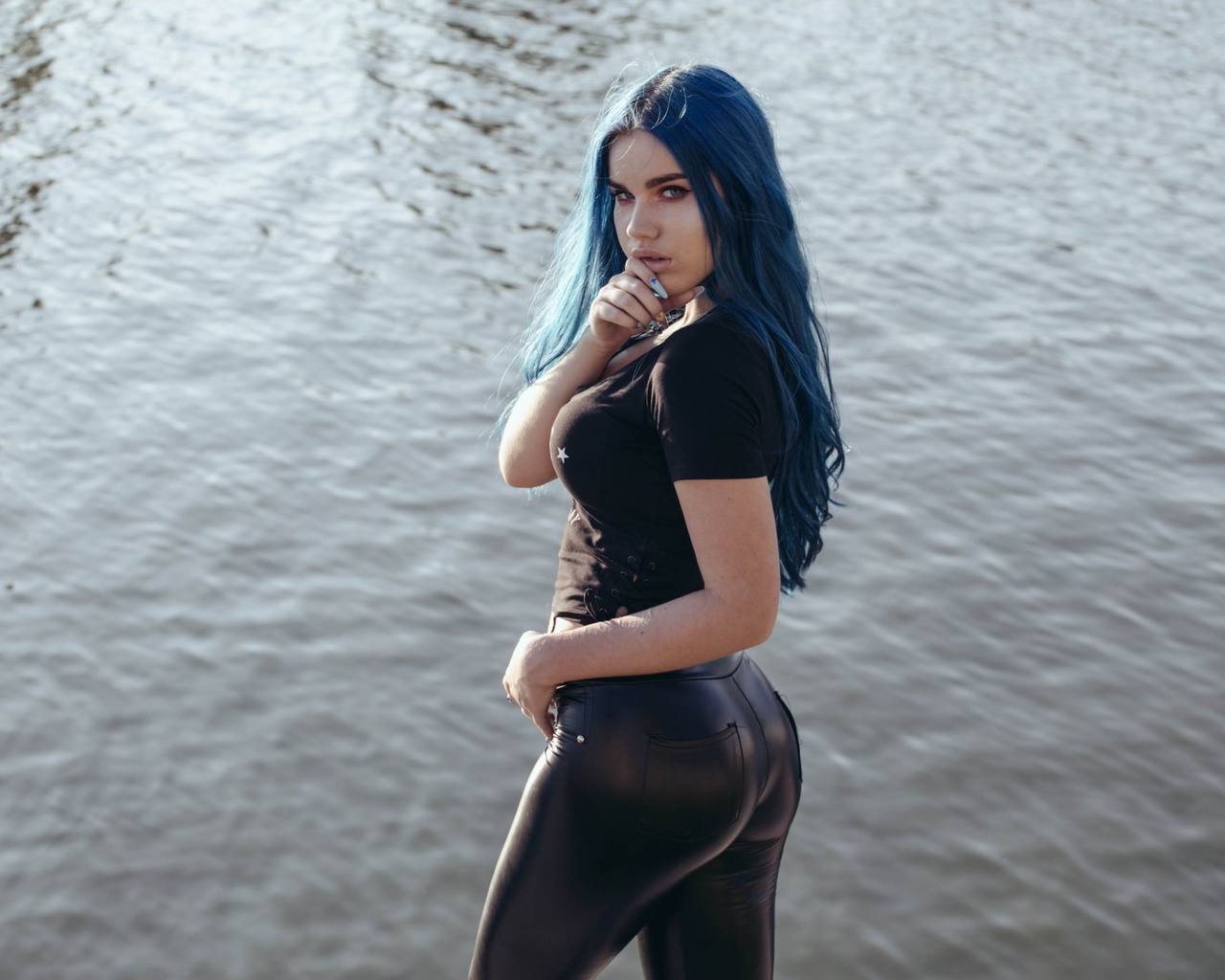 women, blue hair, black clothing, finger on lips, long hair, pants, water, women outdoors, dyed hair