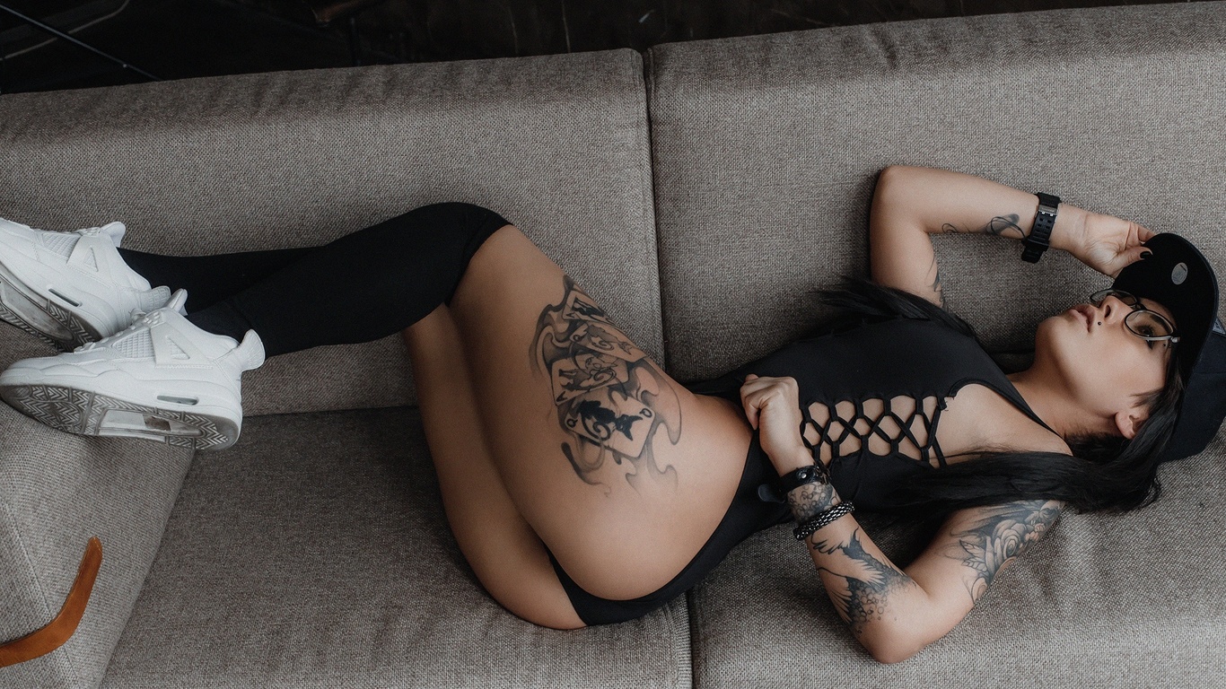 andrey popenko, model, dark hair, couch, lying on side, ass, bodysuit, sneakers, knee highs, women with glasses, bas