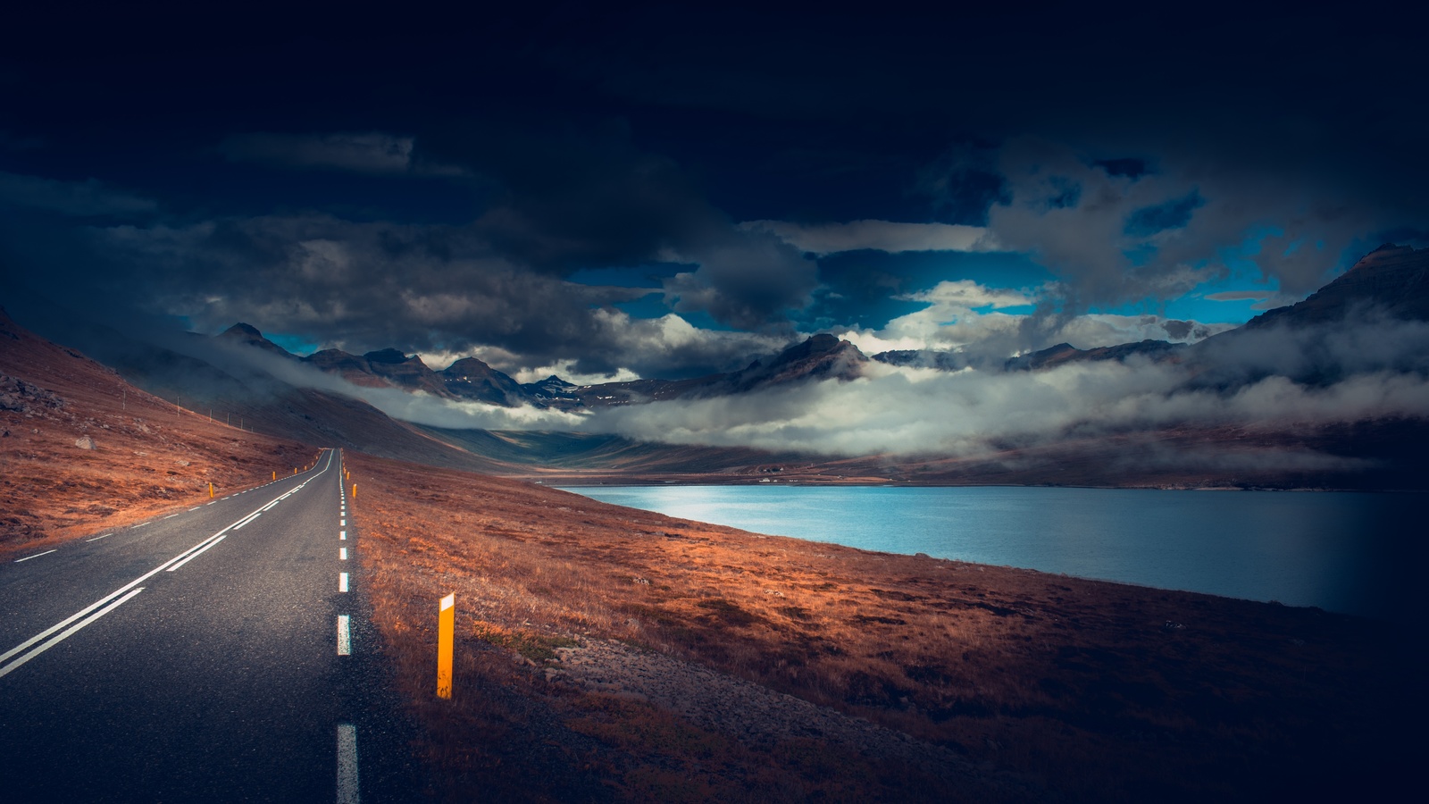 long road, asphalt, lake, dark weather, scenic, clouds