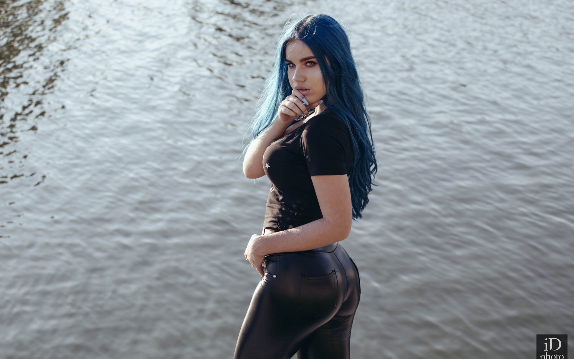 women, blue hair, black clothing, finger on lips, long hair, pants, water, women outdoors, dyed hair