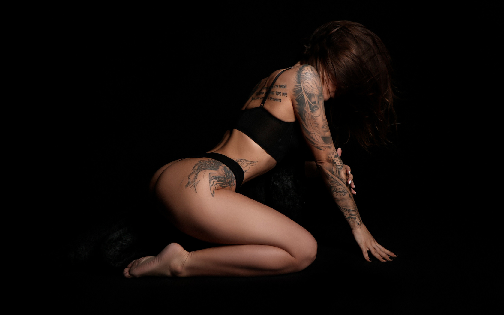 women, black lingerie, brunette, kneeling, ass, black background, painted nails, hair in face, tattoo