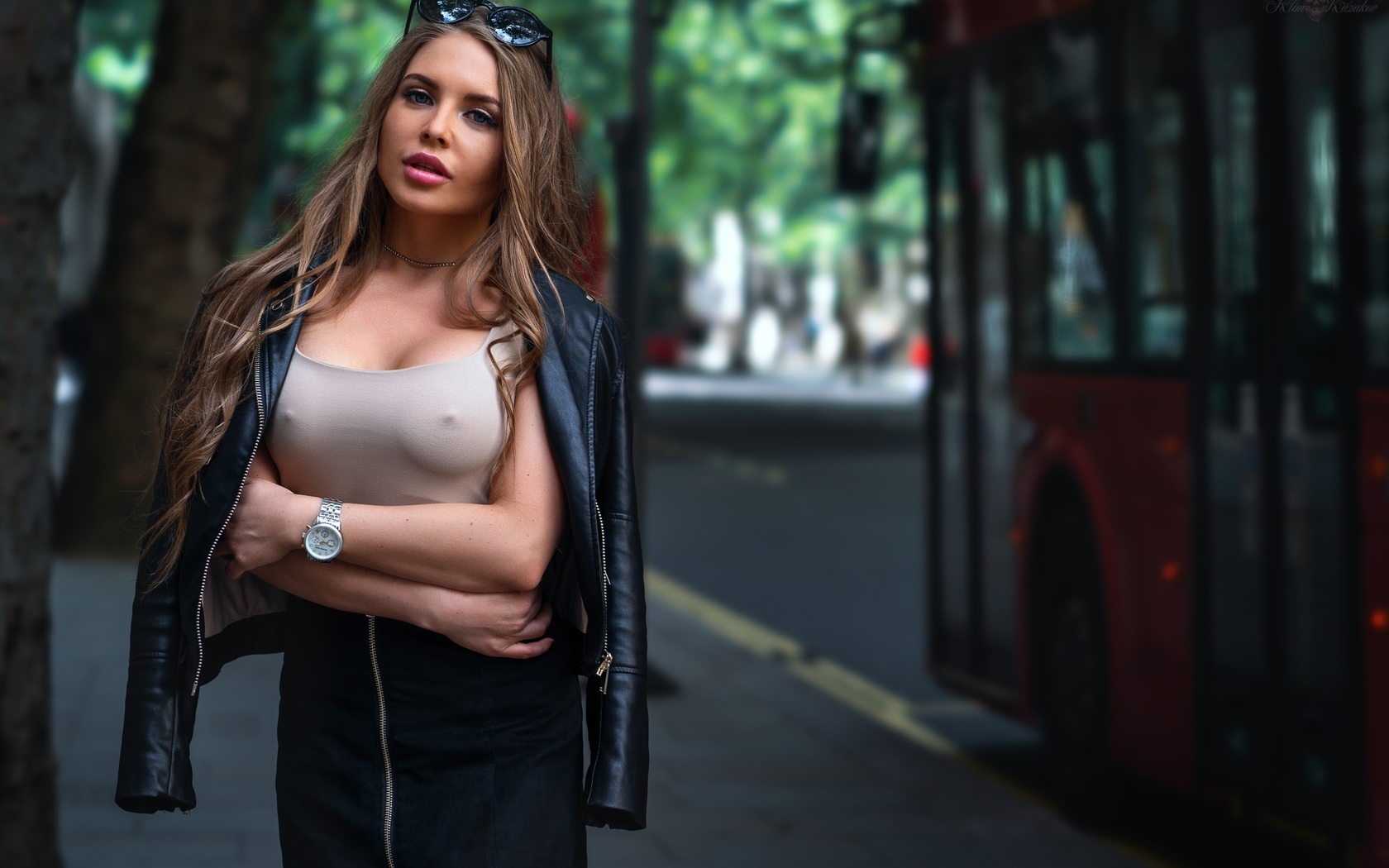 women, trees, buses, arms crossed, sunglasses, nipples through clothing, watch, leather jackets, pink lipstick, portrait