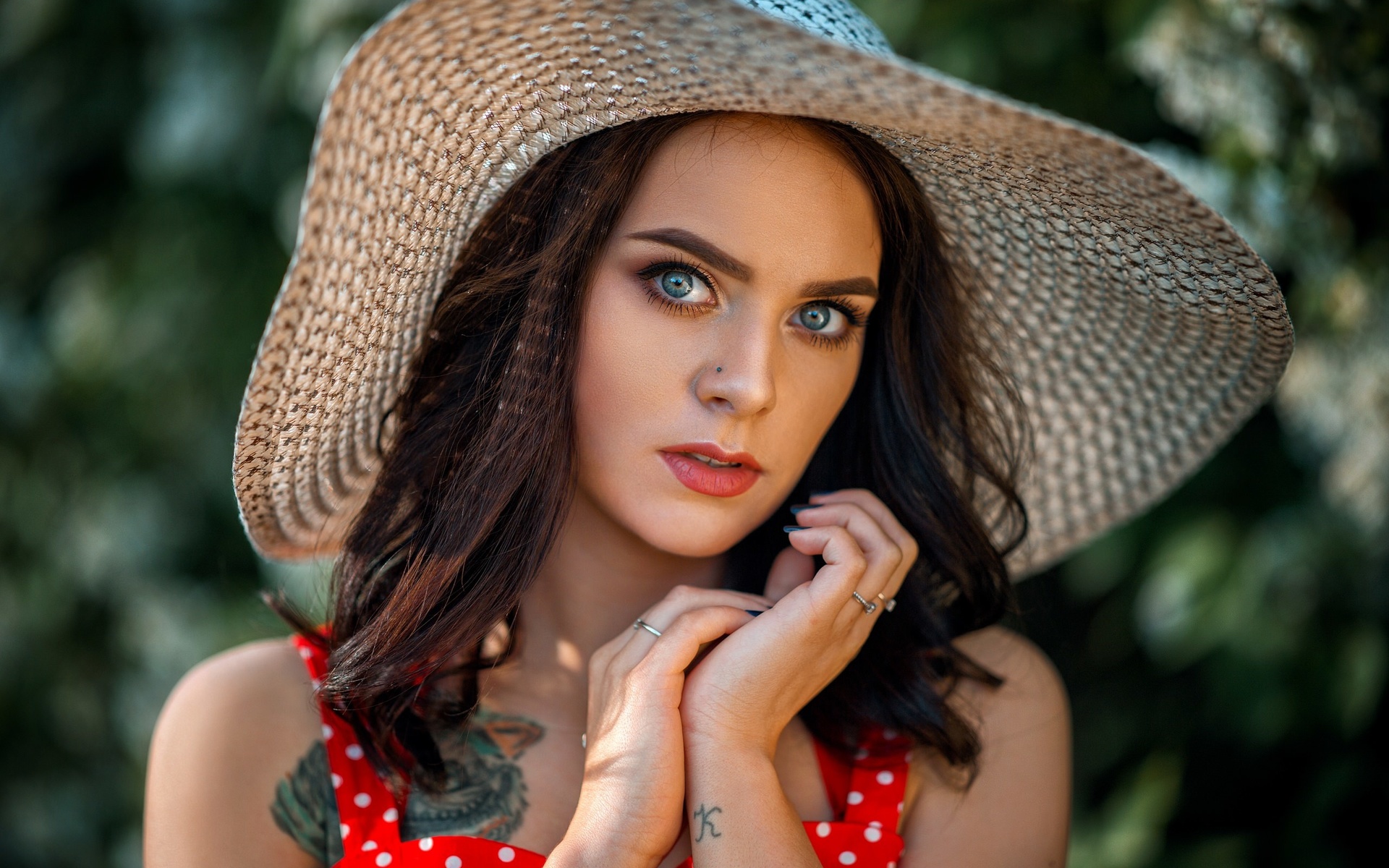 women, red dress, polka dots, women outdoors, tattoo, pierced nose, blue nails, portrait, face, gray eyes, red lipstick, hat