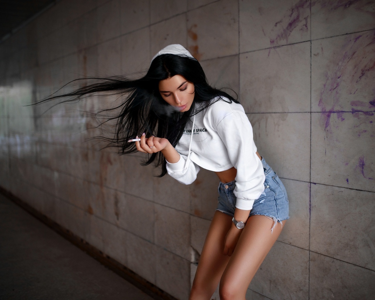 women, brunette, jean shorts, hoods, sweater, black hair, cigarettes, watch, straight hair, smoke, pink nails, closed eyes, wall