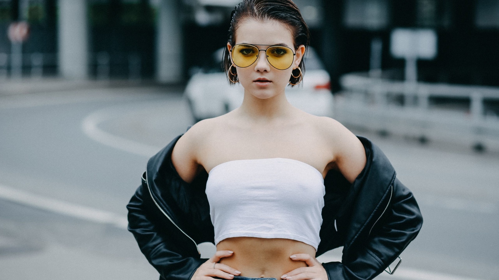 victoria sokolova, women, portrait, women outdoors, women with glasses, leather jackets, tank top, belt, bare shoulders, belly, hands on hips, short hair, jeans,   ,alexander schlesinger