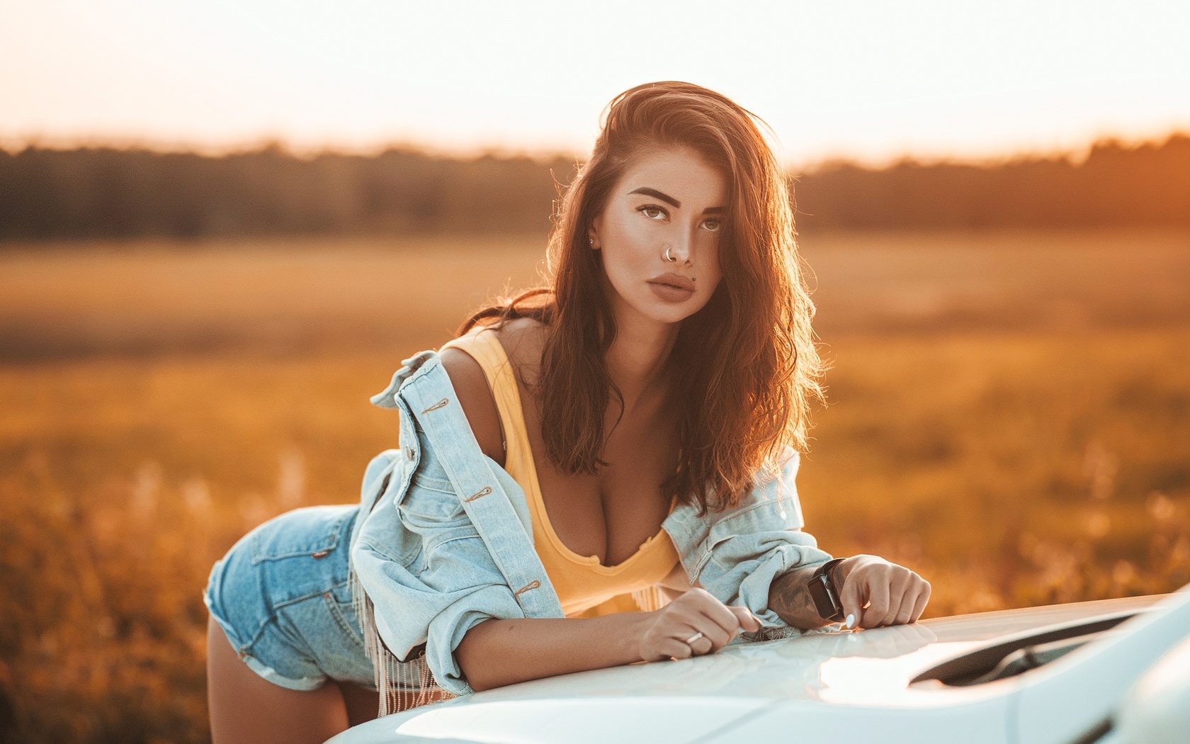 women, brunette, women outdoors, women with cars, tattoo, denim, tank top, jean shorts, sunset, nose ring, piercing, watch, juicy lips