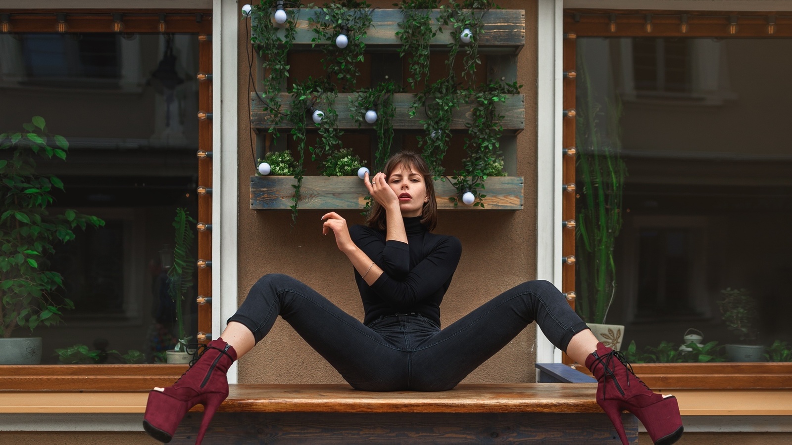 women, sitting, jeans, spread legs, black clothing, window, high heels, plants, red lipstick, table