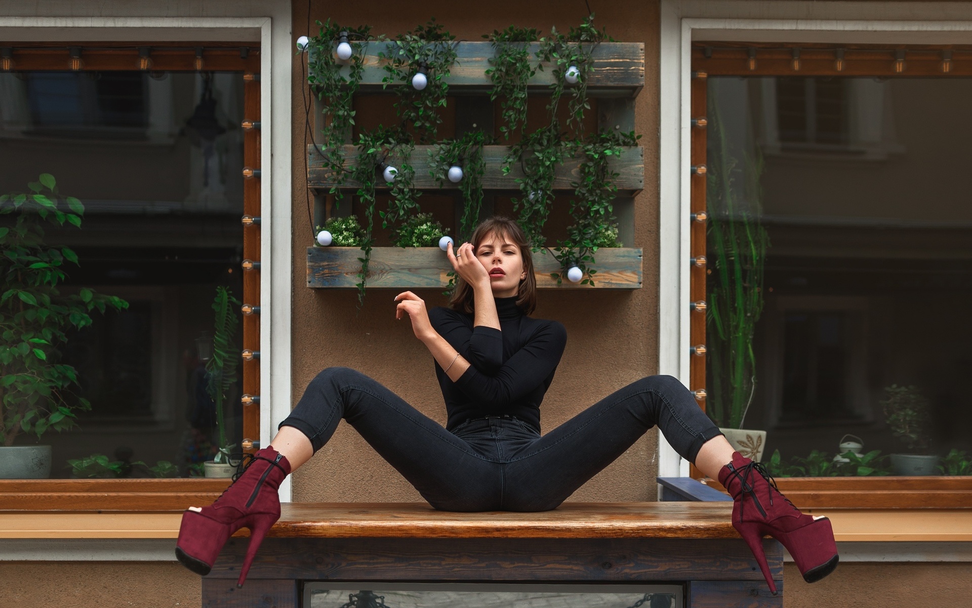 women, sitting, jeans, spread legs, black clothing, window, high heels, plants, red lipstick, table