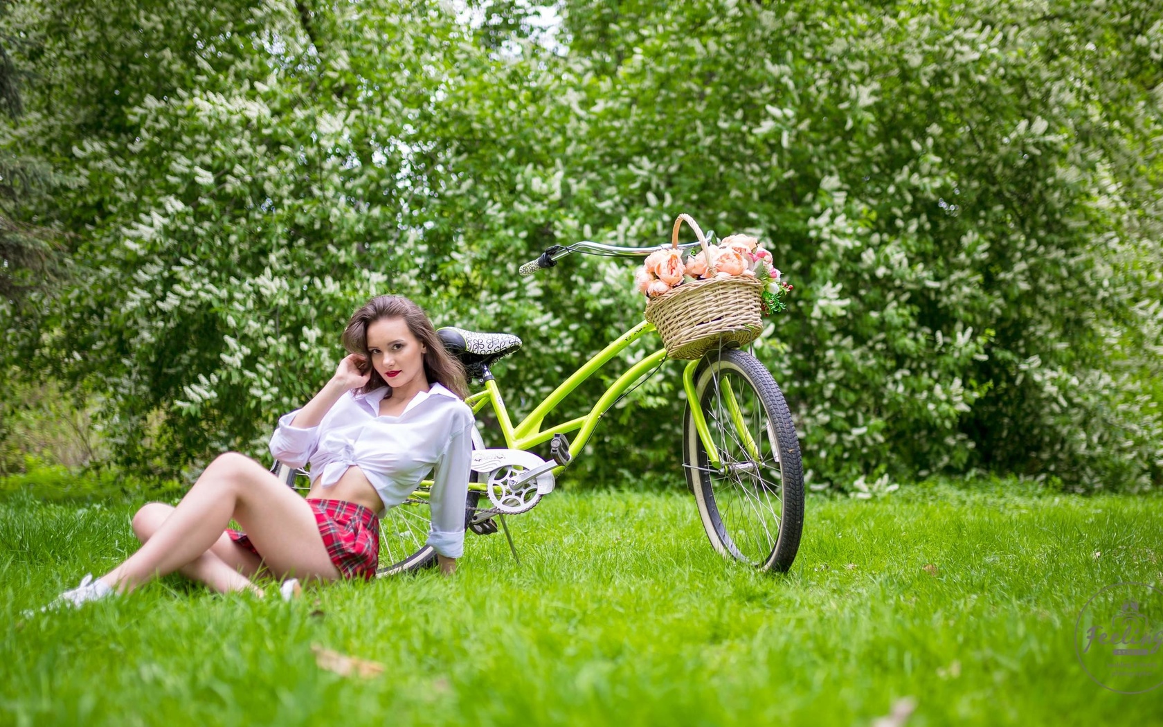 women, plaid skirt, white shirt, schoolgirl uniform, flowers, women outdoors, women with bicycles, bicycle, sitting, grass, red lipstick, sneakers, smiling, skirt, white socks