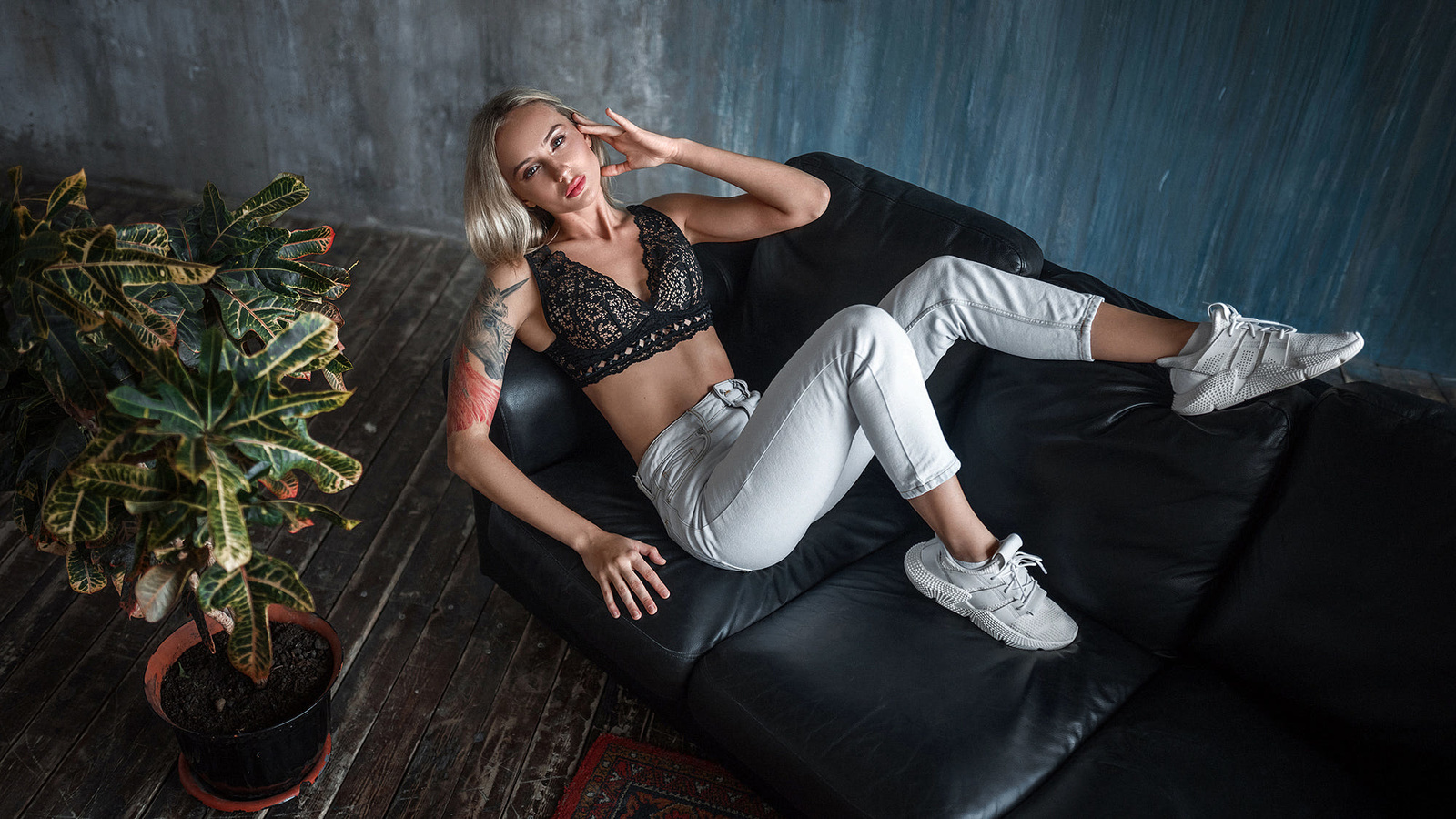 women, blonde, top view, couch, wall, wooden floor, plants, tattoo, sneakers, pants, cleavage, brunette, women indoors