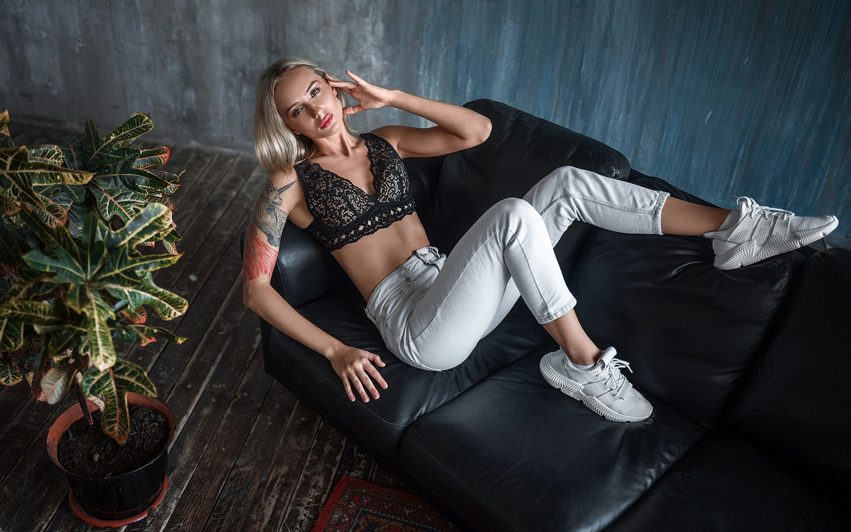 women, blonde, top view, couch, wall, wooden floor, plants, tattoo, sneakers, pants, cleavage, brunette, women indoors