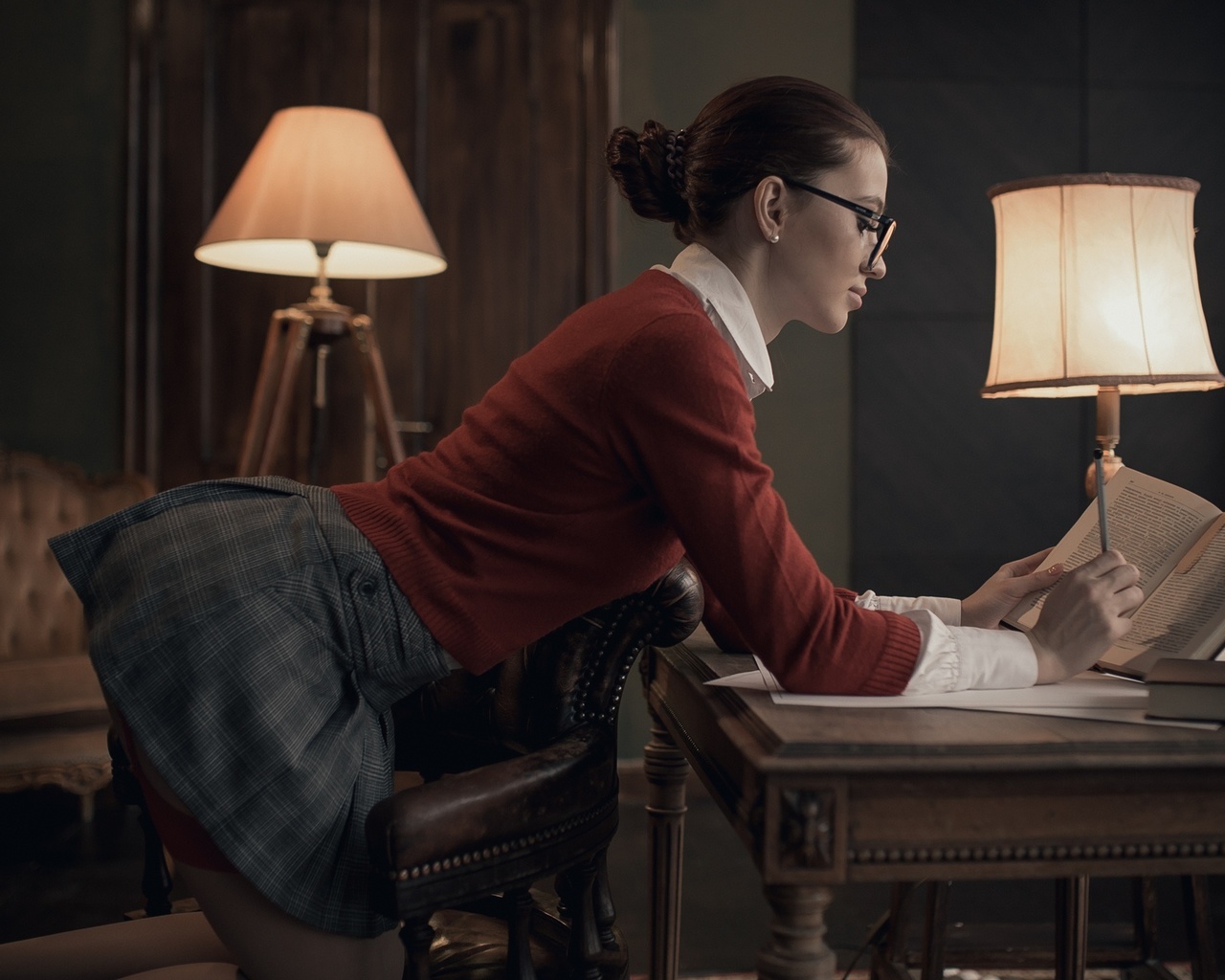 women, lamp, women indoors, skirt, hairbun, chair, garter belt, red sweater, mirror, books, kneeling, women with glasses, reflection