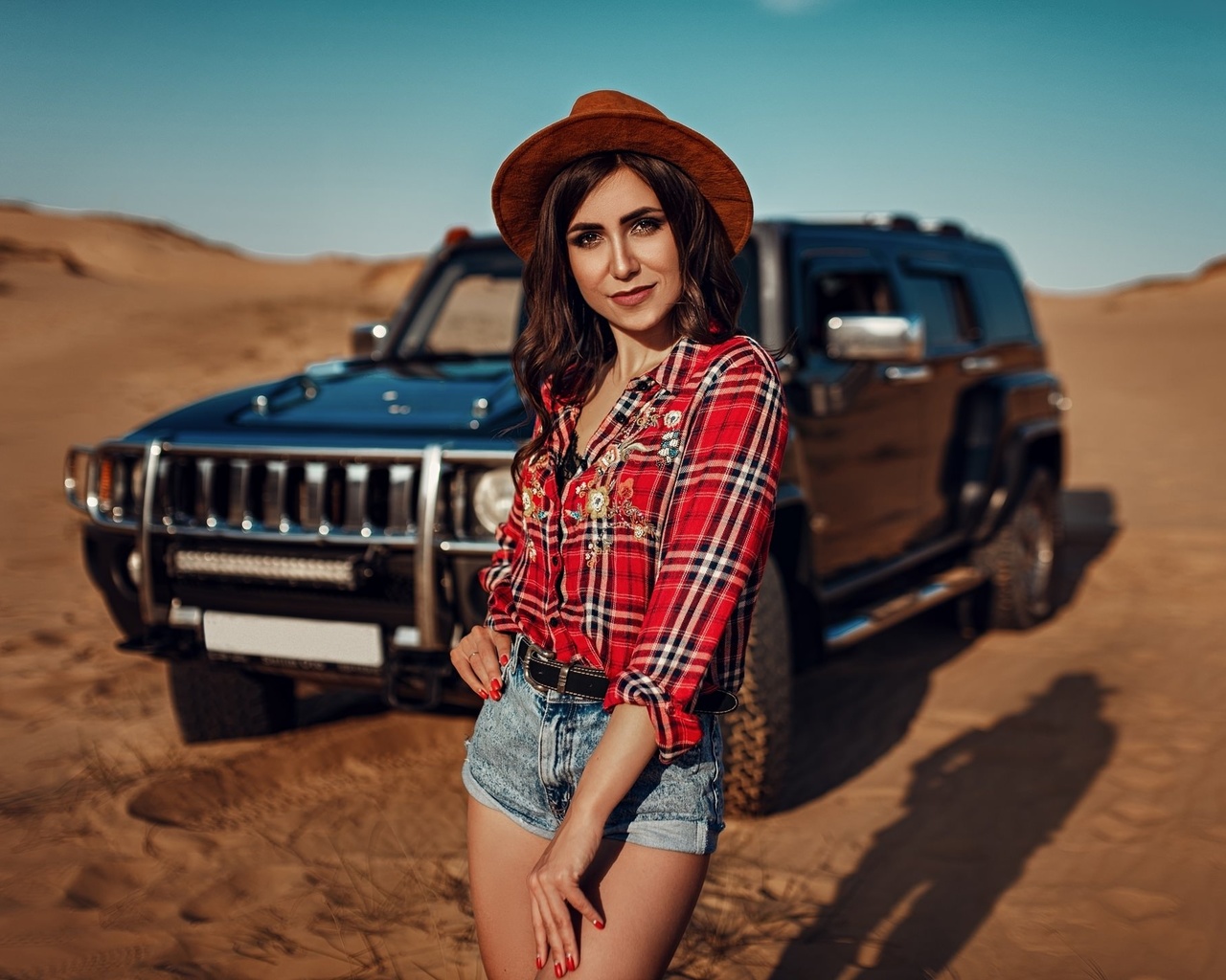 women, hat, women outdoors, sky, clouds, car, desert, plaid shirt, jean shorts, women with cars, smiling, red nails, belt