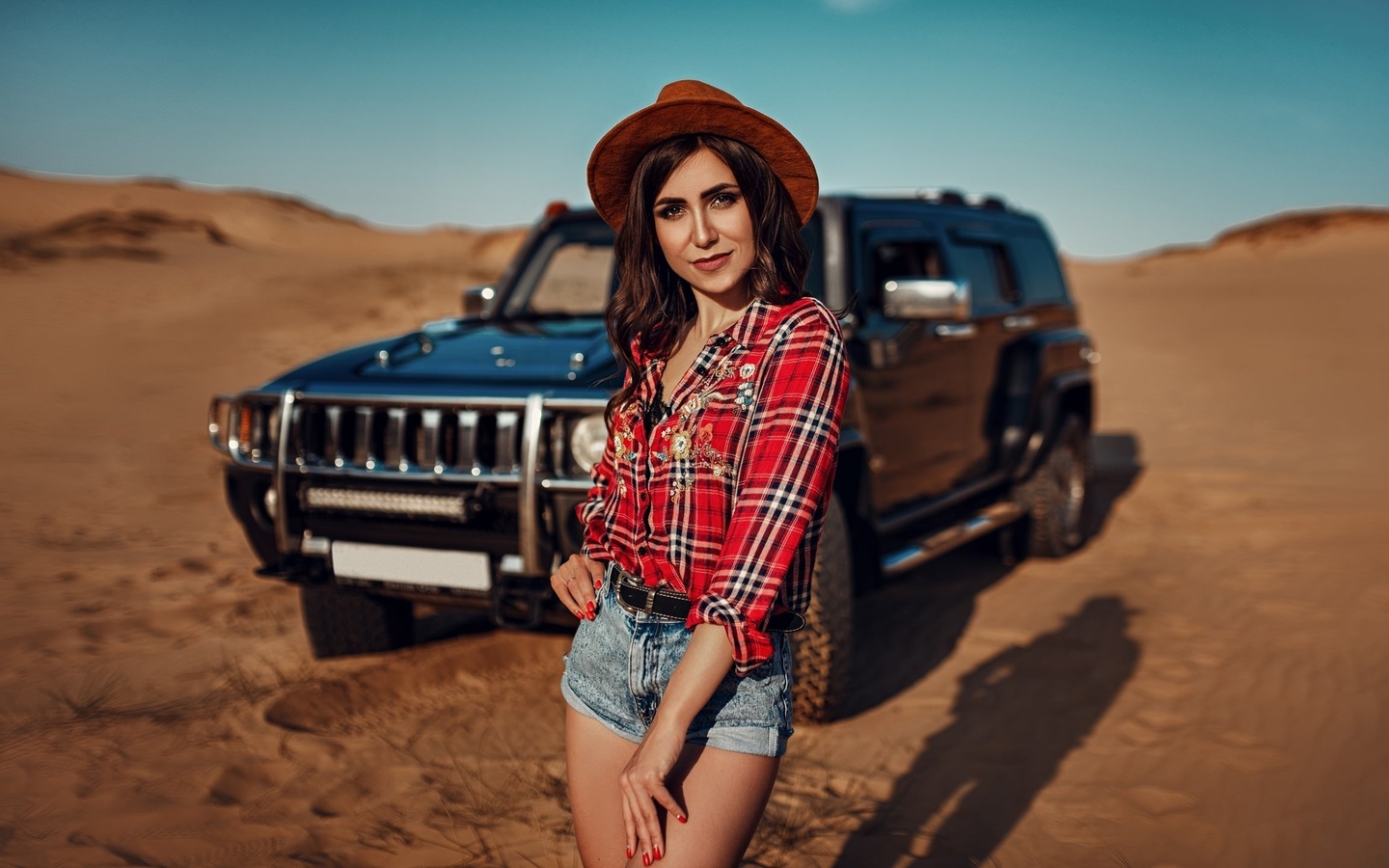 women, hat, women outdoors, sky, clouds, car, desert, plaid shirt, jean shorts, women with cars, smiling, red nails, belt