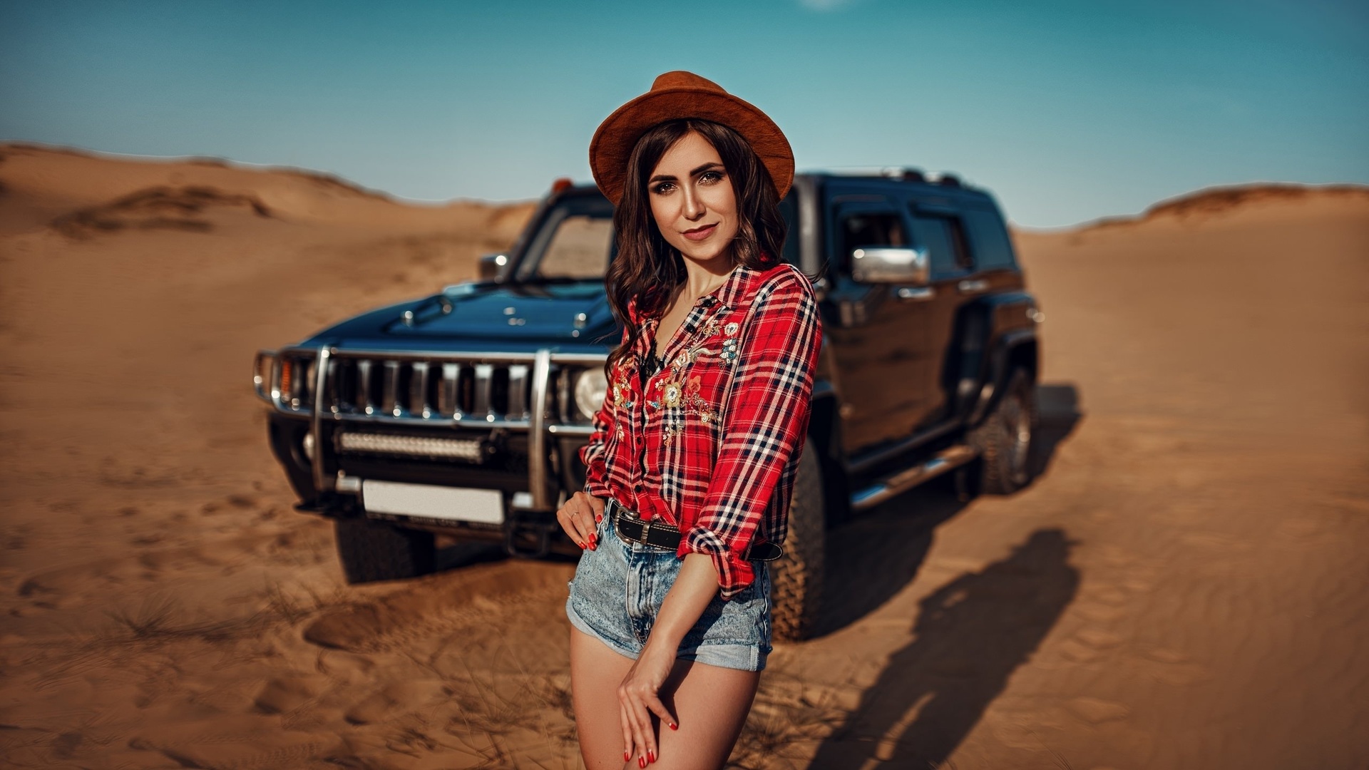 women, hat, women outdoors, sky, clouds, car, desert, plaid shirt, jean shorts, women with cars, smiling, red nails, belt