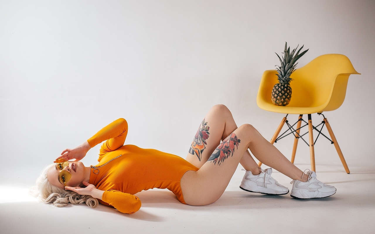 women, studio, sneakers, blonde, chair, pineapple, tattoo, glasses, bodysuit, leotard, on the floor