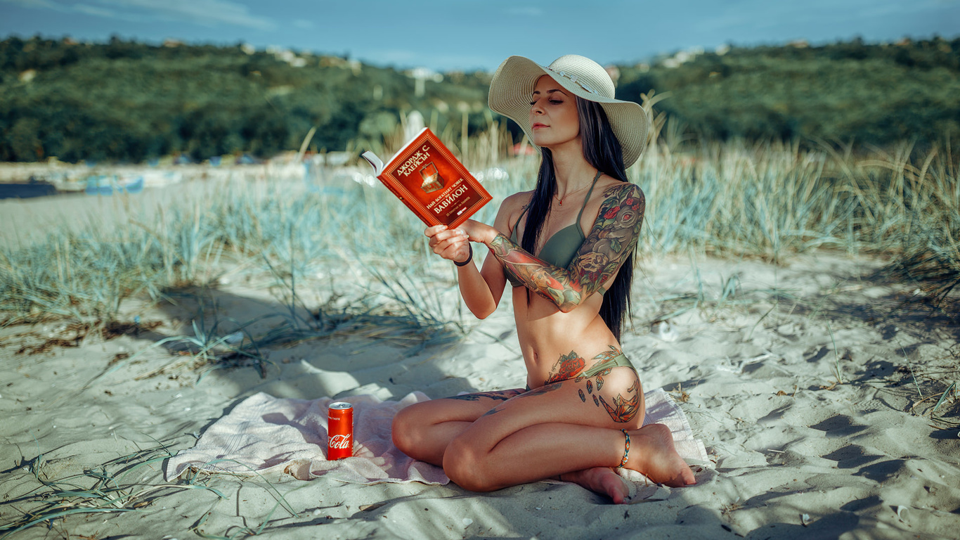 women, hat, bikini, brunette, women outdoors, books, tattoo, sand, sky, coca-cola, belly, sitting, long hair, towel