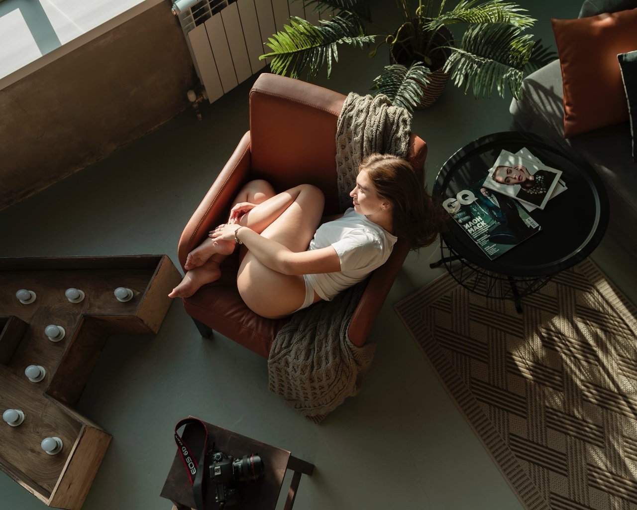 women, white t-shirt, white panties, women indoors, top view, window, light bulb, ass, brunette, armchair, camera, magazine, plants, couch