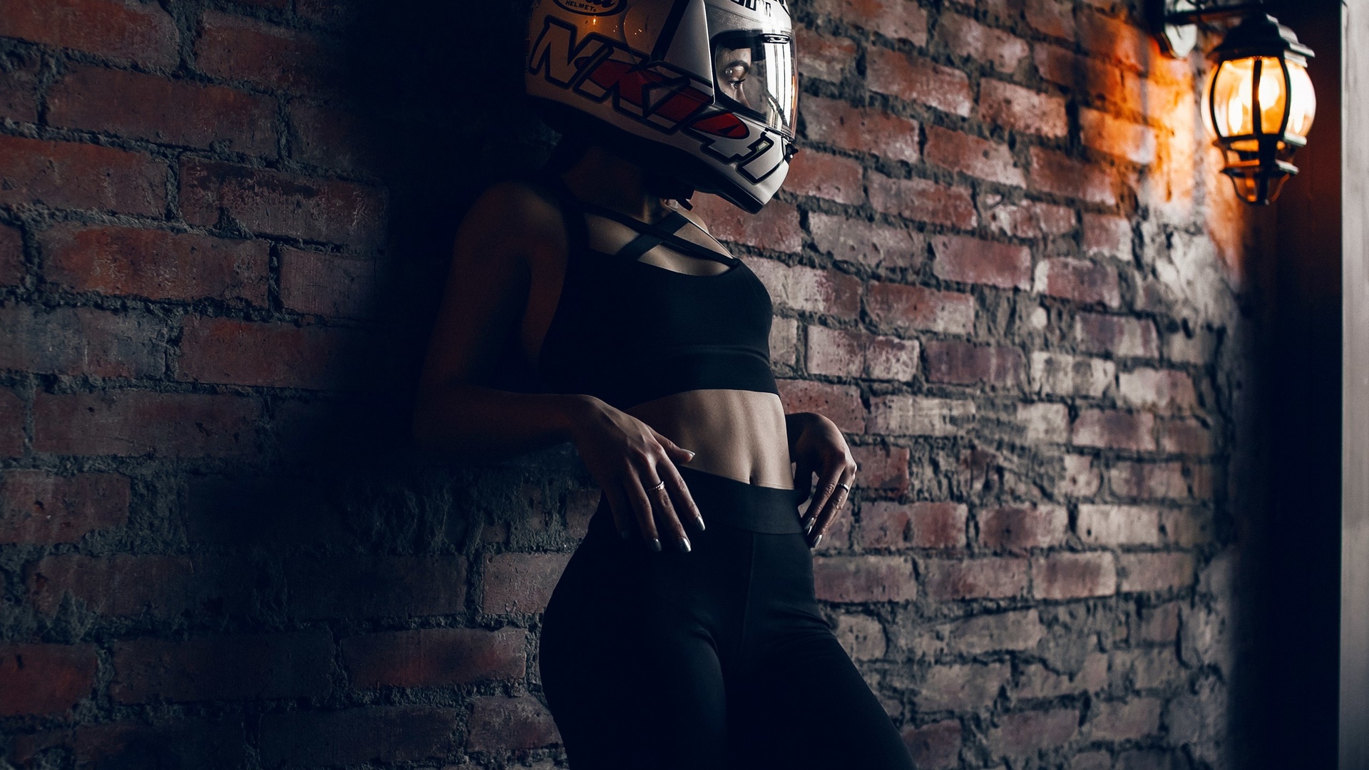 brunette, helmet, model, wall, lamp, belly, belly button, pants, top