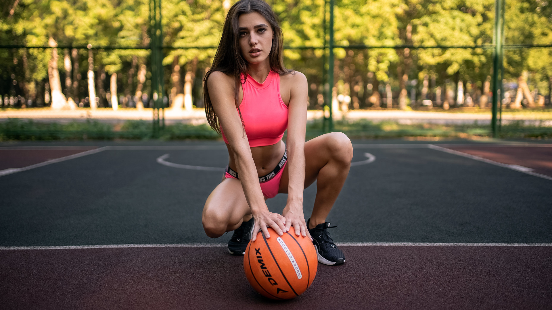 women, basketball court, sportswear, ball, women outdoors, sneakers, trees, squatting, belly, brunette