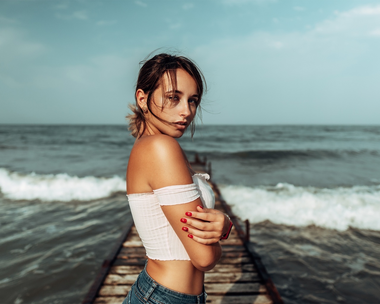 women, brunette, sea, women outdoors, jean shorts, red nails, pier, bare shoulders, watch, arms crossed, sky