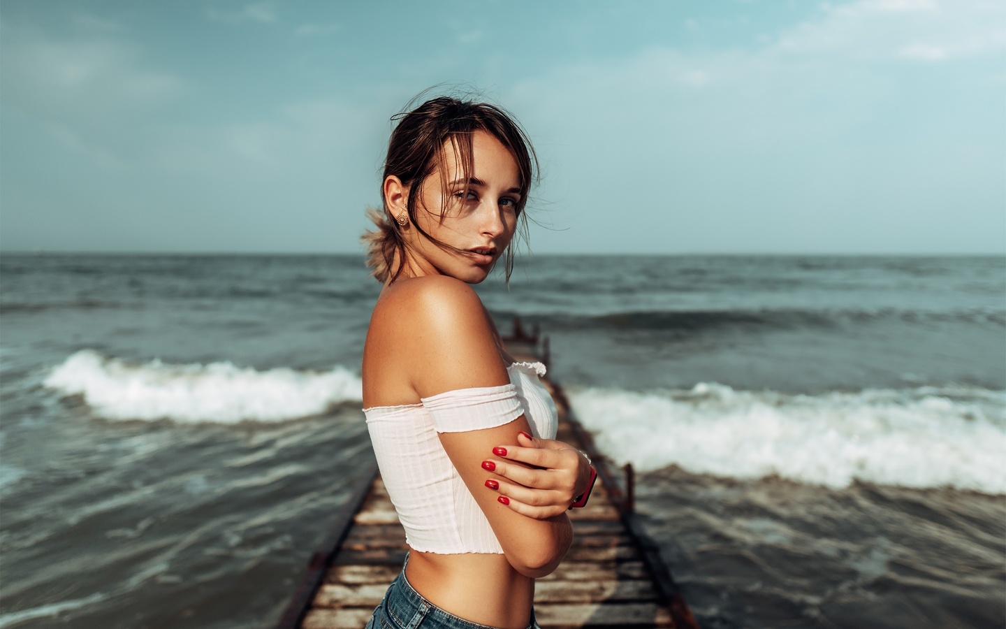 women, brunette, sea, women outdoors, jean shorts, red nails, pier, bare shoulders, watch, arms crossed, sky