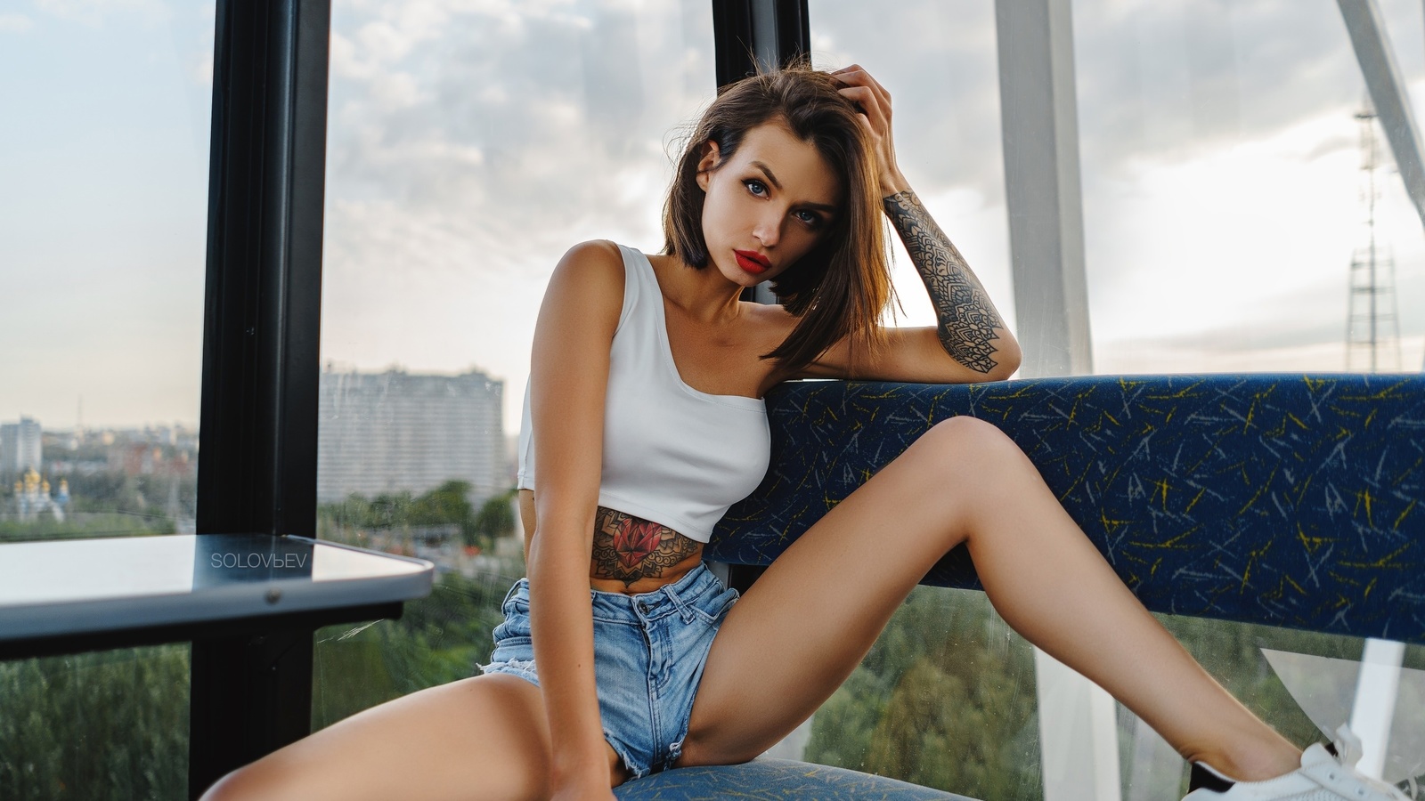 alyona elizarova, women, artem solovev, sitting, sneakers, jean shorts, red nails, red lipstick, tattoo, belly, brunette, spread legs