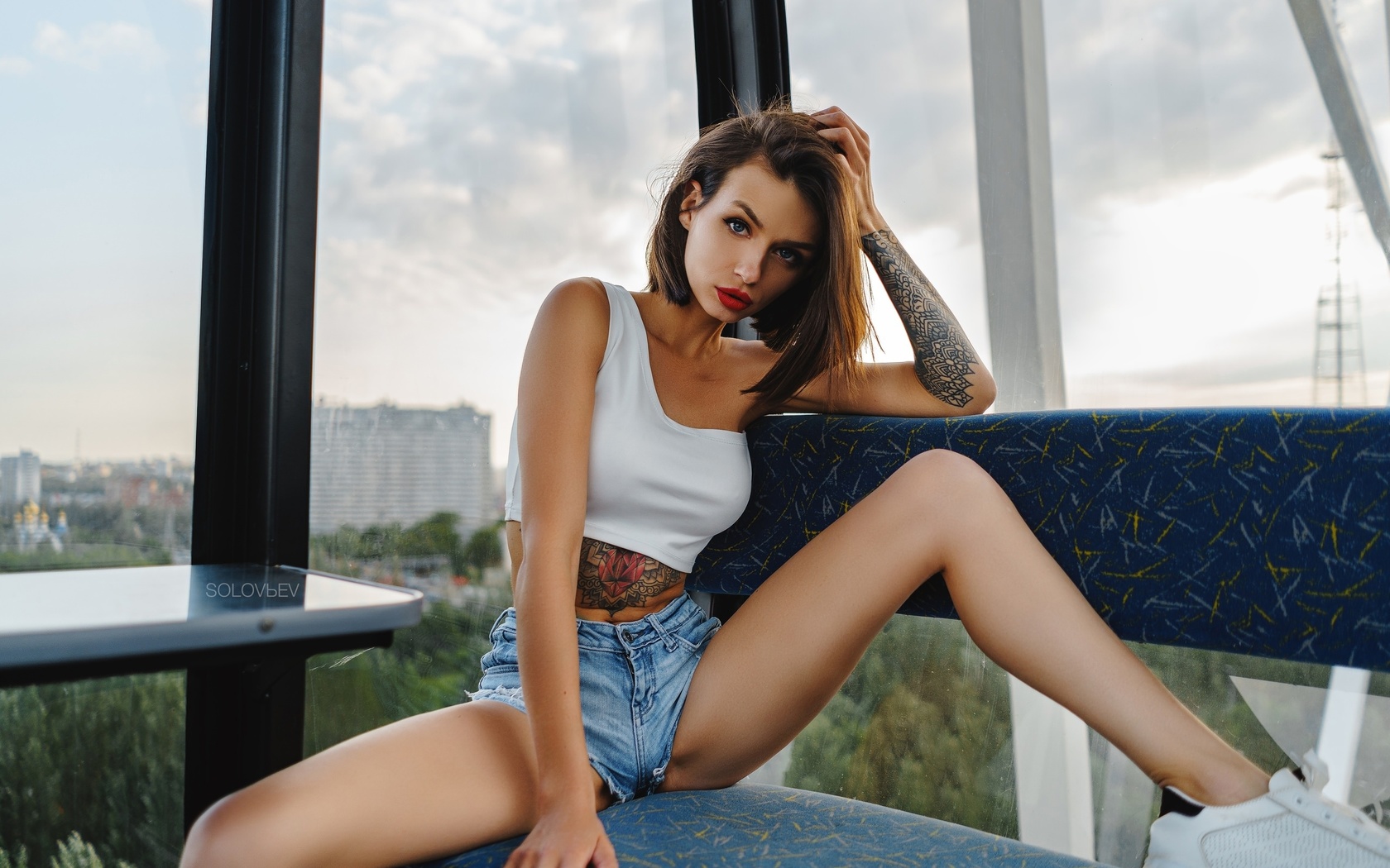 alyona elizarova, women, artem solovev, sitting, sneakers, jean shorts, red nails, red lipstick, tattoo, belly, brunette, spread legs