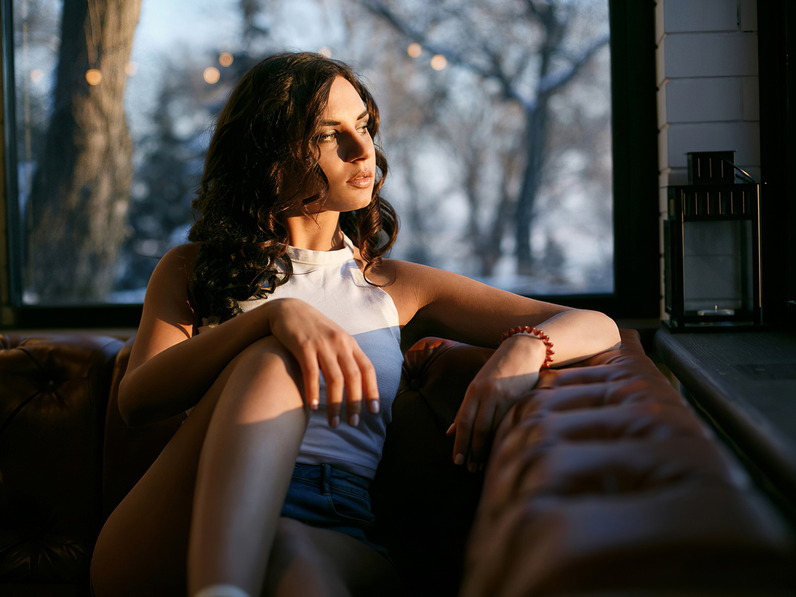 brunette, women, window, model, jean shorts, t-shirt, sitting, couch, trees