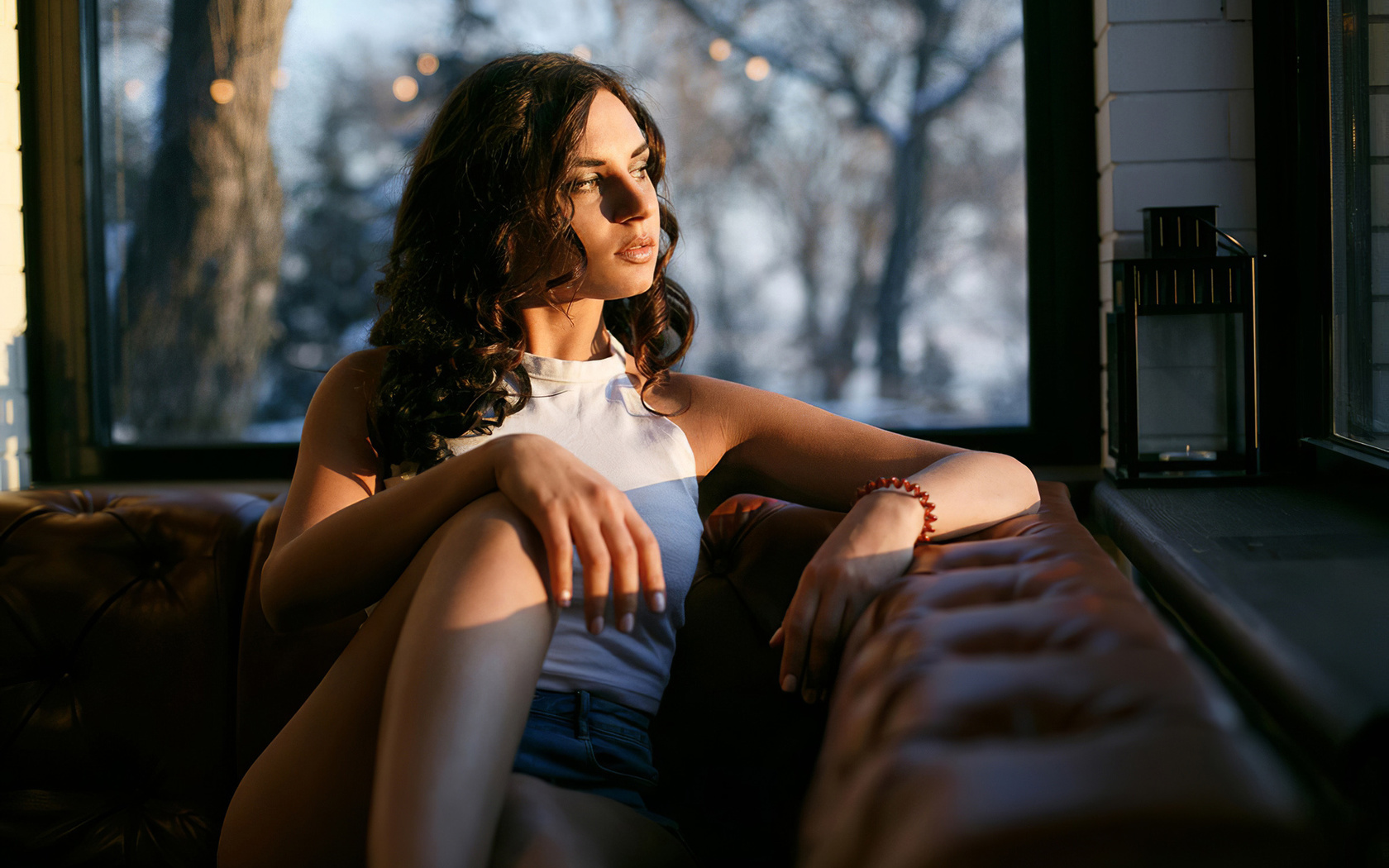 brunette, women, window, model, jean shorts, t-shirt, sitting, couch, trees