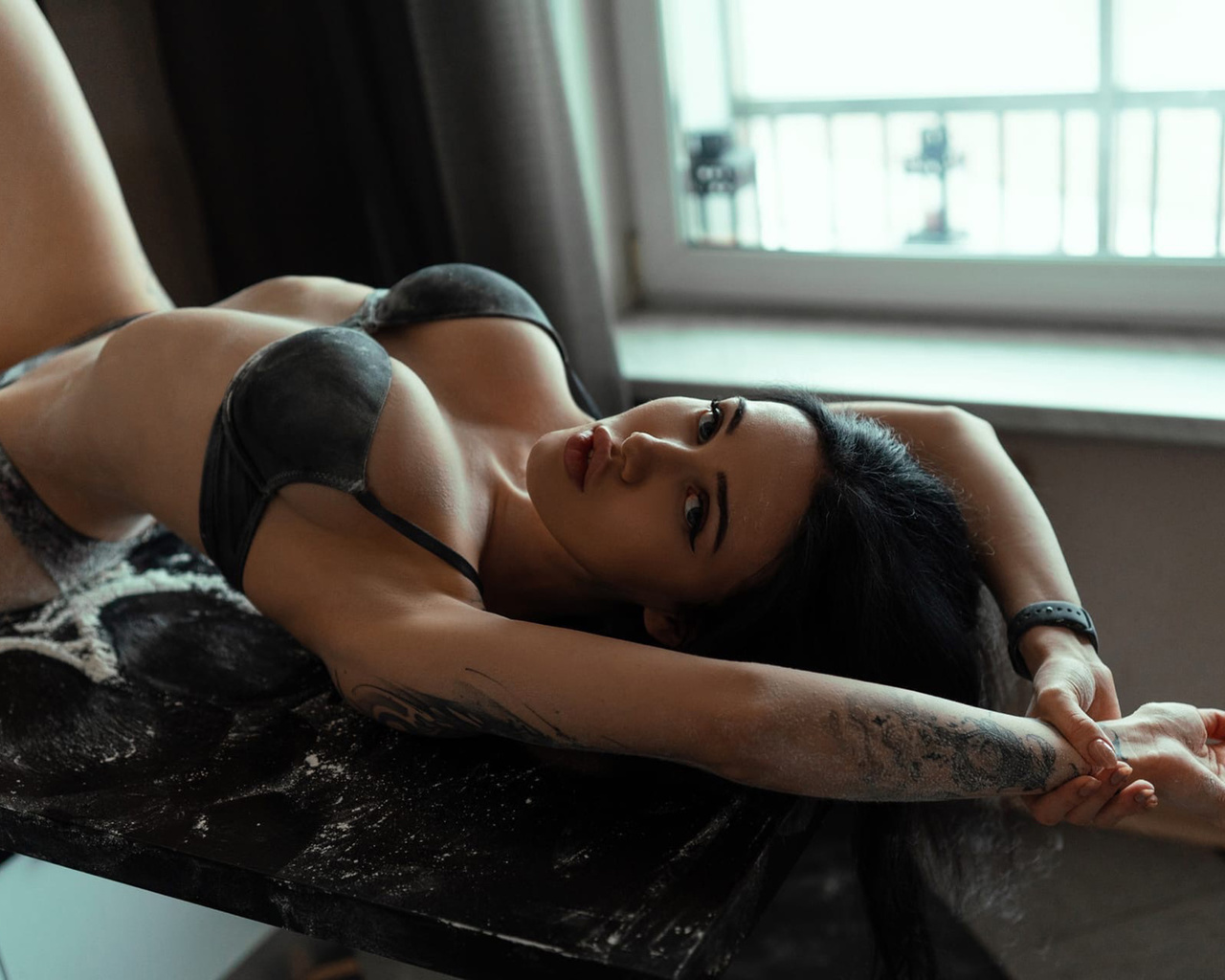 women, brunette, model, women indoors, kitchen, black lingerie, lingerie, black panties, black bra, hips, ass, boobs, window, table, flour, tattoo