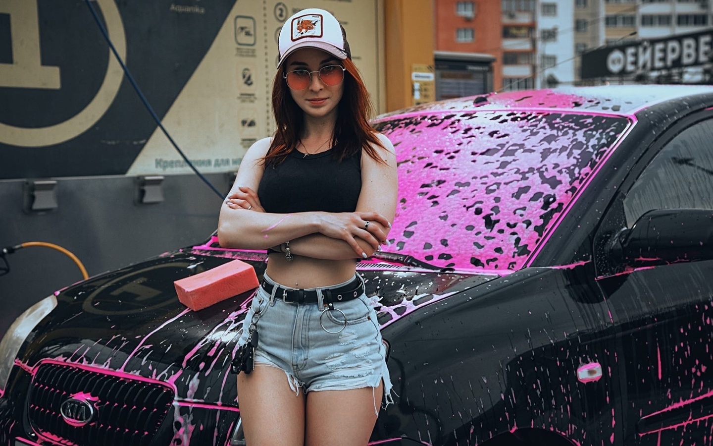 model, women, redhead, women outdoors, women with glasses, sunglasses, baseball cap, short tops, jean shorts, kia, women with cars, vehicle, pierced navel, car washes