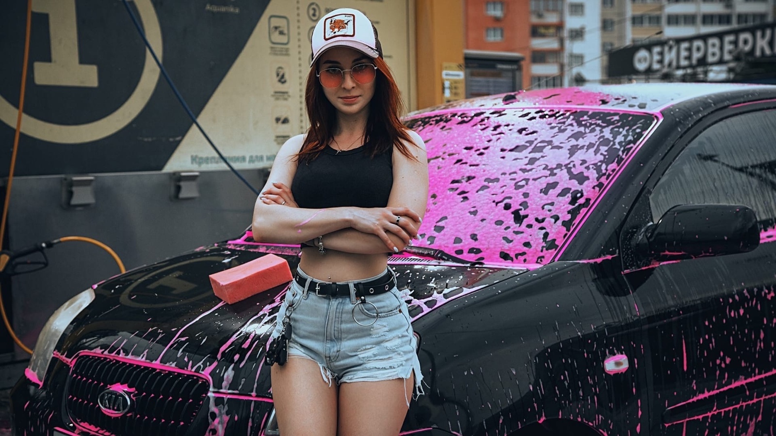 model, women, redhead, women outdoors, women with glasses, sunglasses, baseball cap, short tops, jean shorts, kia, women with cars, vehicle, pierced navel, car washes