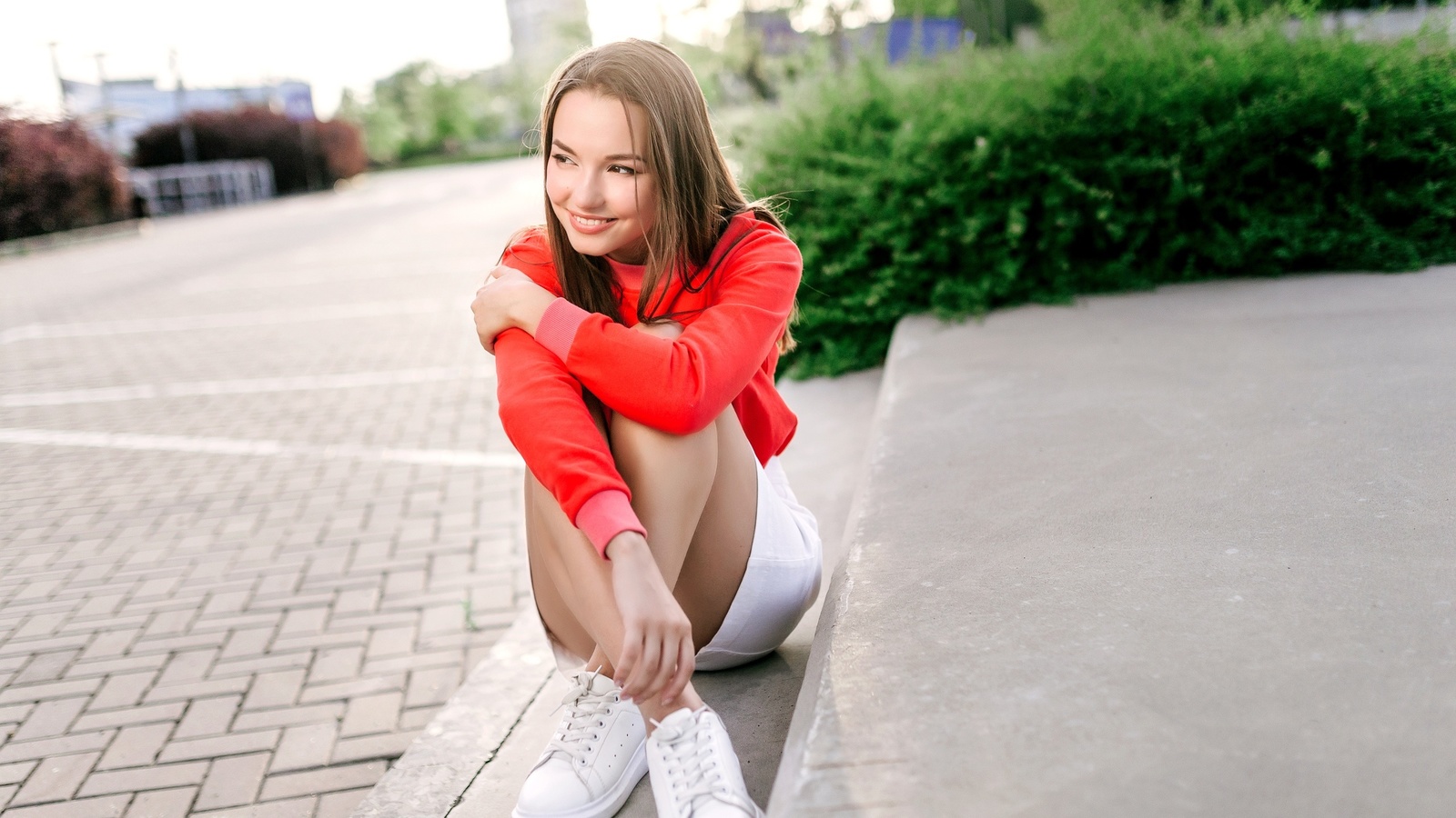 model, women, brunette, women outdoors, miniskirt, skirt, sweater, sneakers, plants, smiling, street