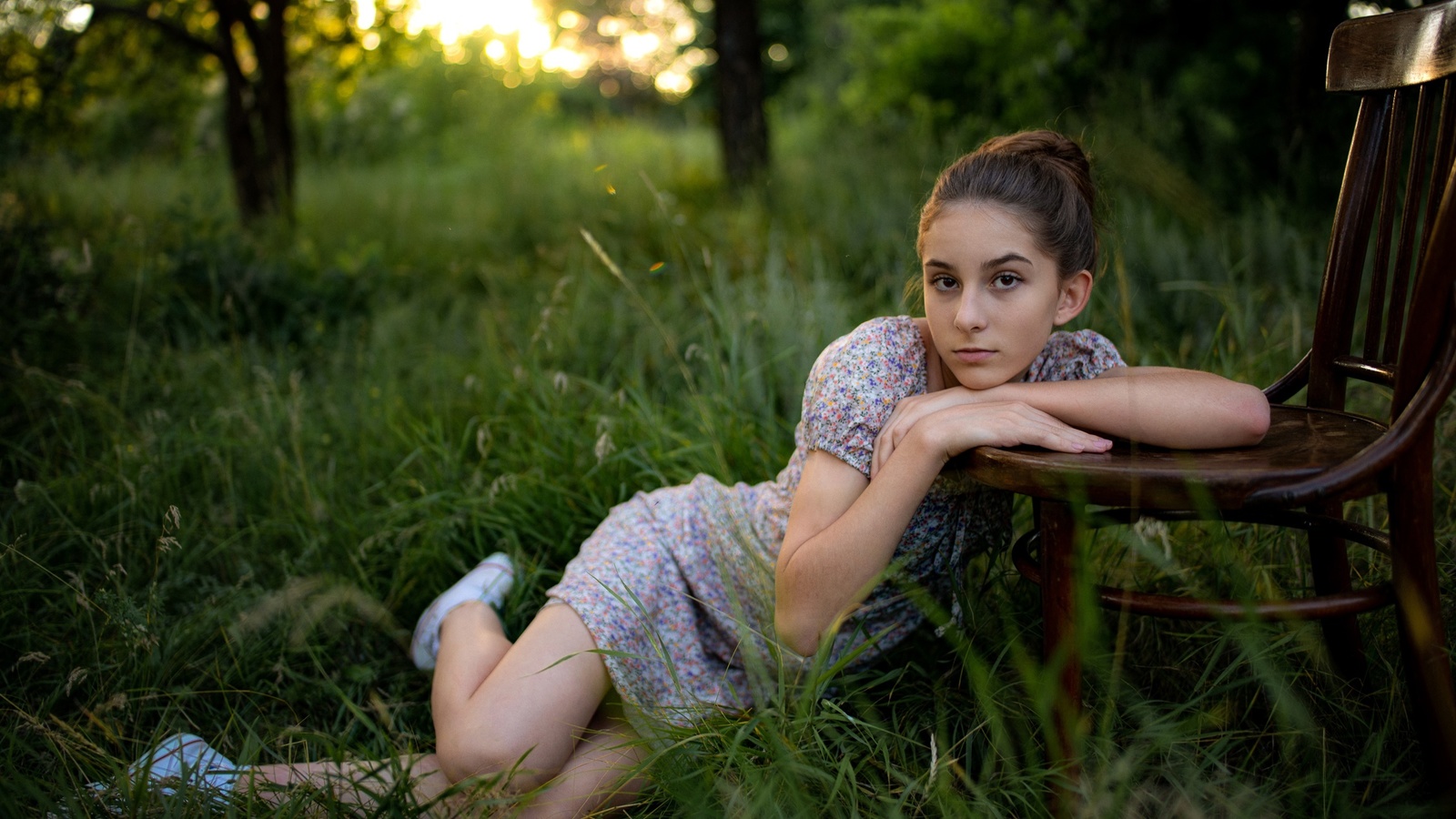 model, brunette, women, women outdoors, grass, trees, nature, dress, summer dress, flowered dress, chair, converse, sneakers