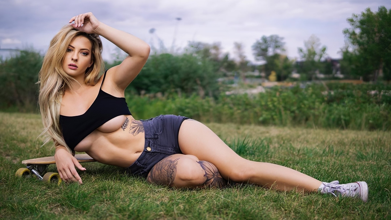 blonde, brunette, model, women, grass, women outdoors, clouds, sky, trees, underboob, tattoo, sneakers, hips, jean shorts, skateboard