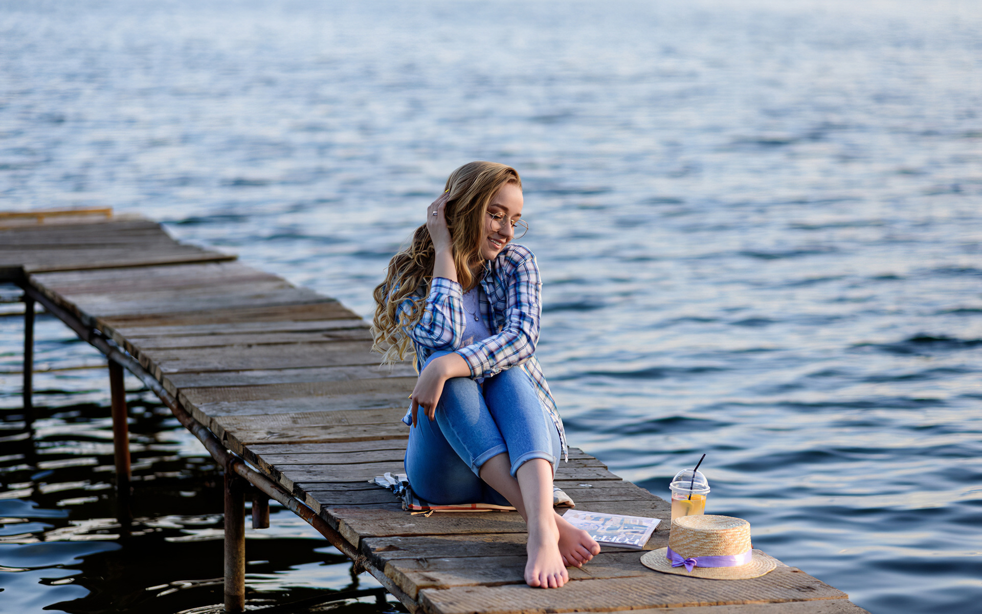 women, blonde, model, women outdoors, plaid shirt, jeans, hips, water, women with glasses, straw hat, lake, sitting