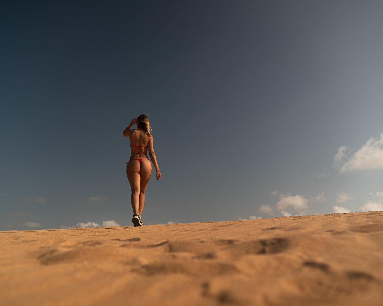 women, model, brunette, women outdoors, red bikini, bikini, ass, hips, curvy, desert, sky, clouds, sneakers, rear view