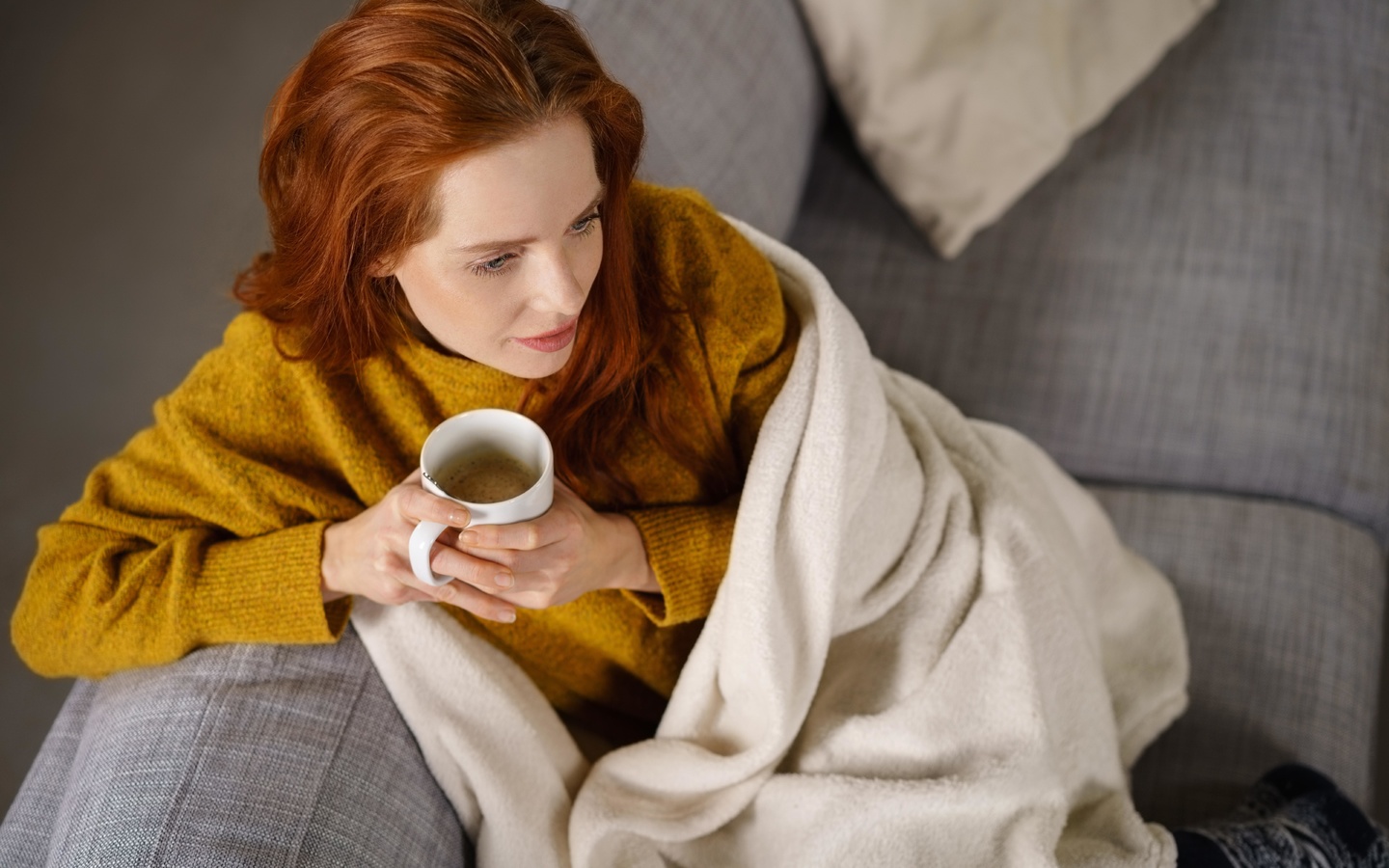 woman, comfortable couch, blanket, coffee