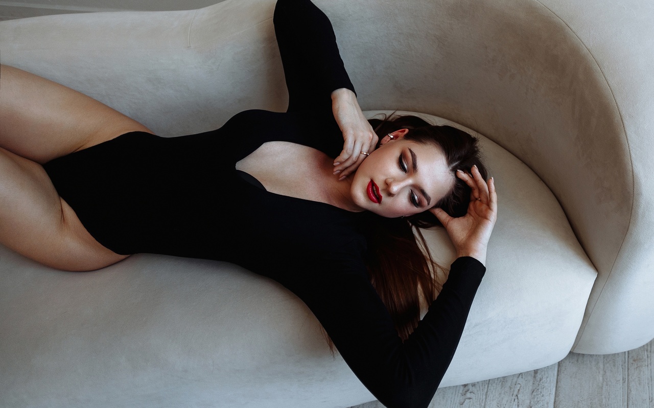 model, women, brunette, hips, couch, women indoors, black bodysuit, bodysuit, wooden floor