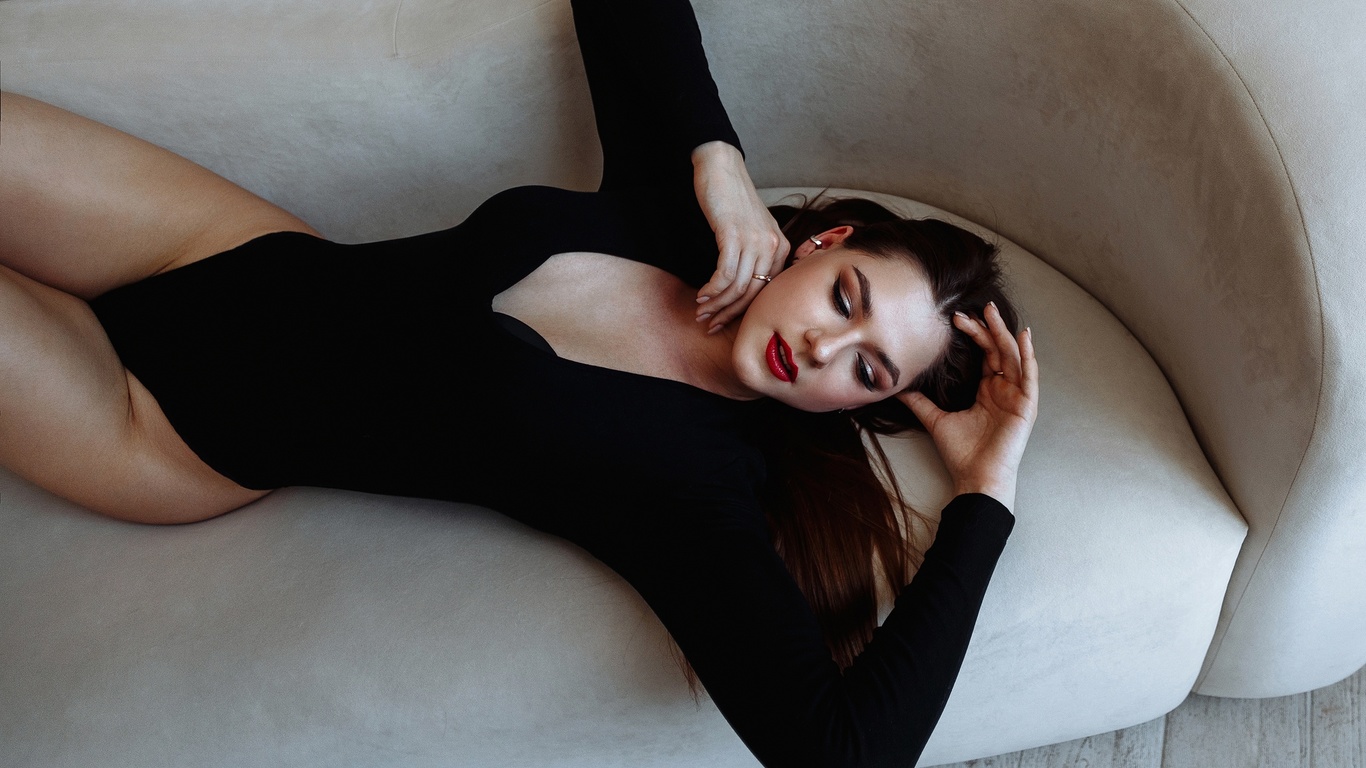 model, women, brunette, hips, couch, women indoors, black bodysuit, bodysuit, wooden floor