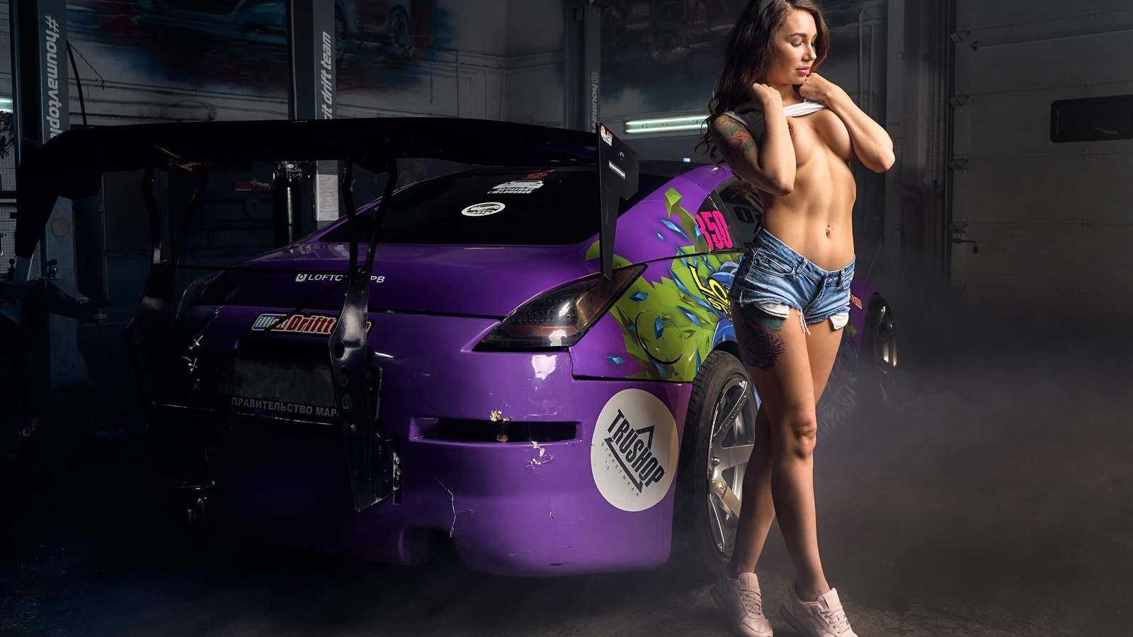 alexandra roz, brunette, women, model, anime car, car, purple cars, women indoors, boobs, covering boobs, jean shorts, tattoo, hips, tank top