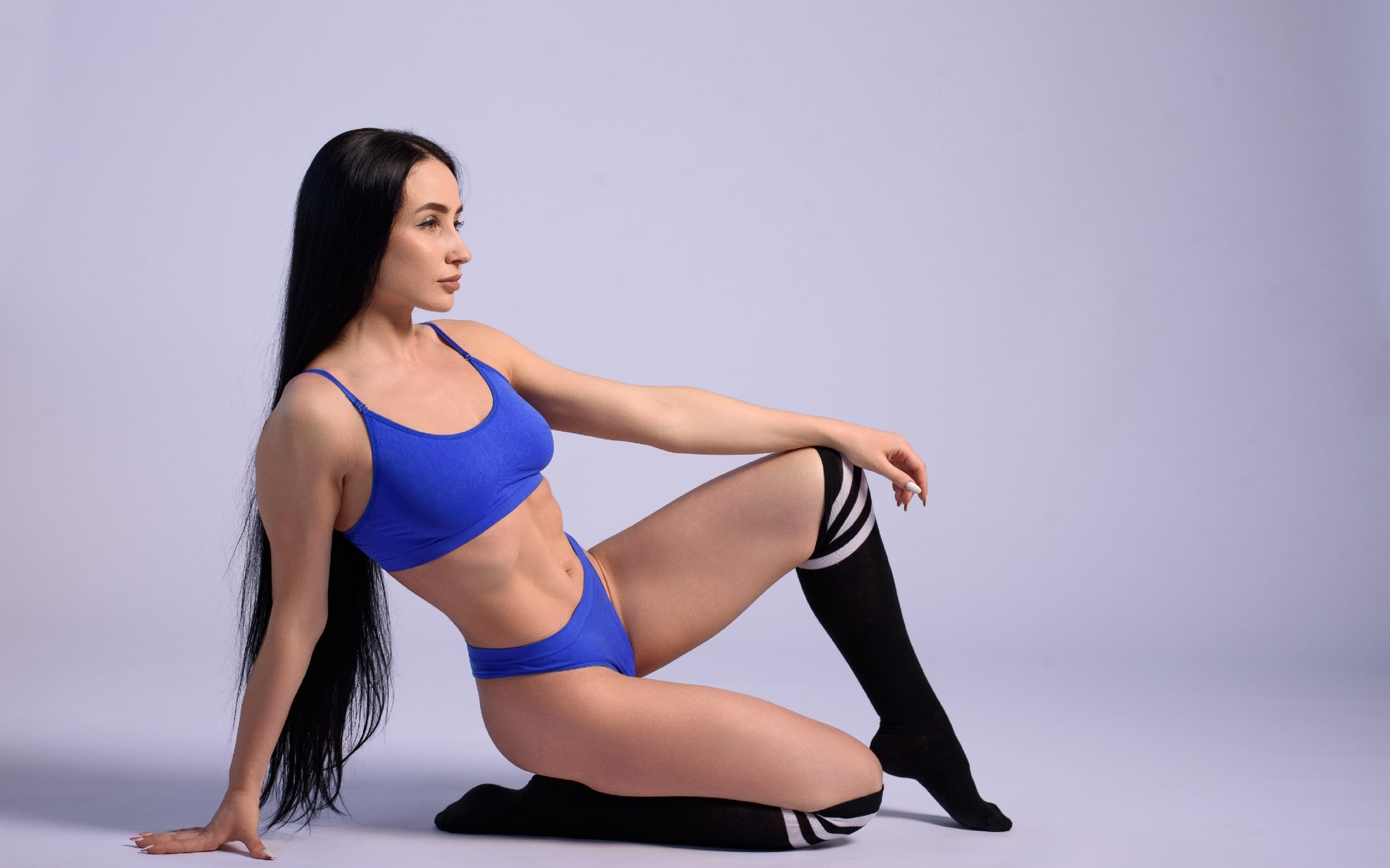 brunette, model, women, studio, blue tops, sports bra, fitness model, blue panties, women indoors, white background, simple background, ass, hips, long hair, black socks, striped socks