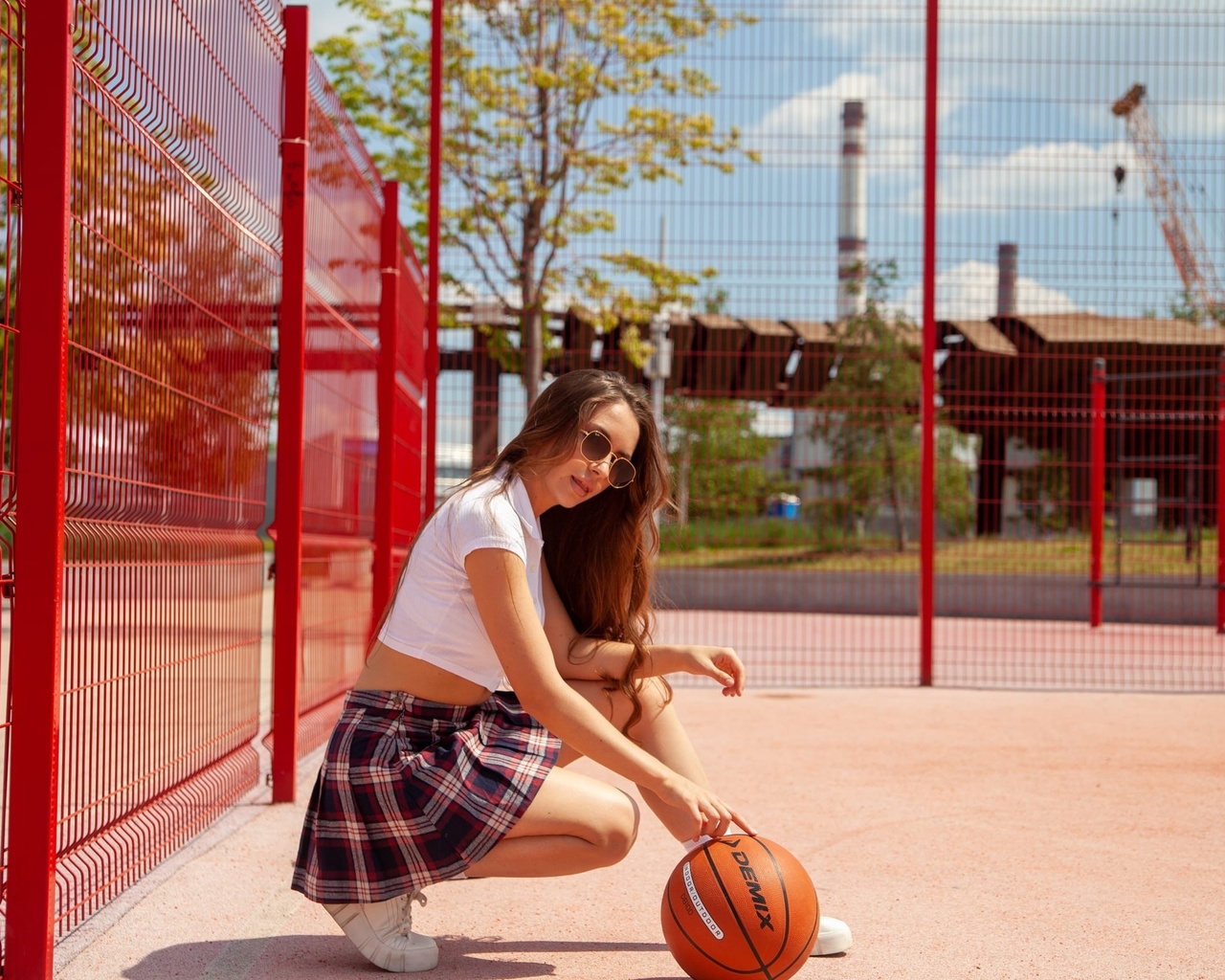 public, girl, basketball ball, women outdoors, sunglasses, women, brunette, model, plaid skirt, short tops, t-shirt, white t-shirt, sneakers, sky, clouds