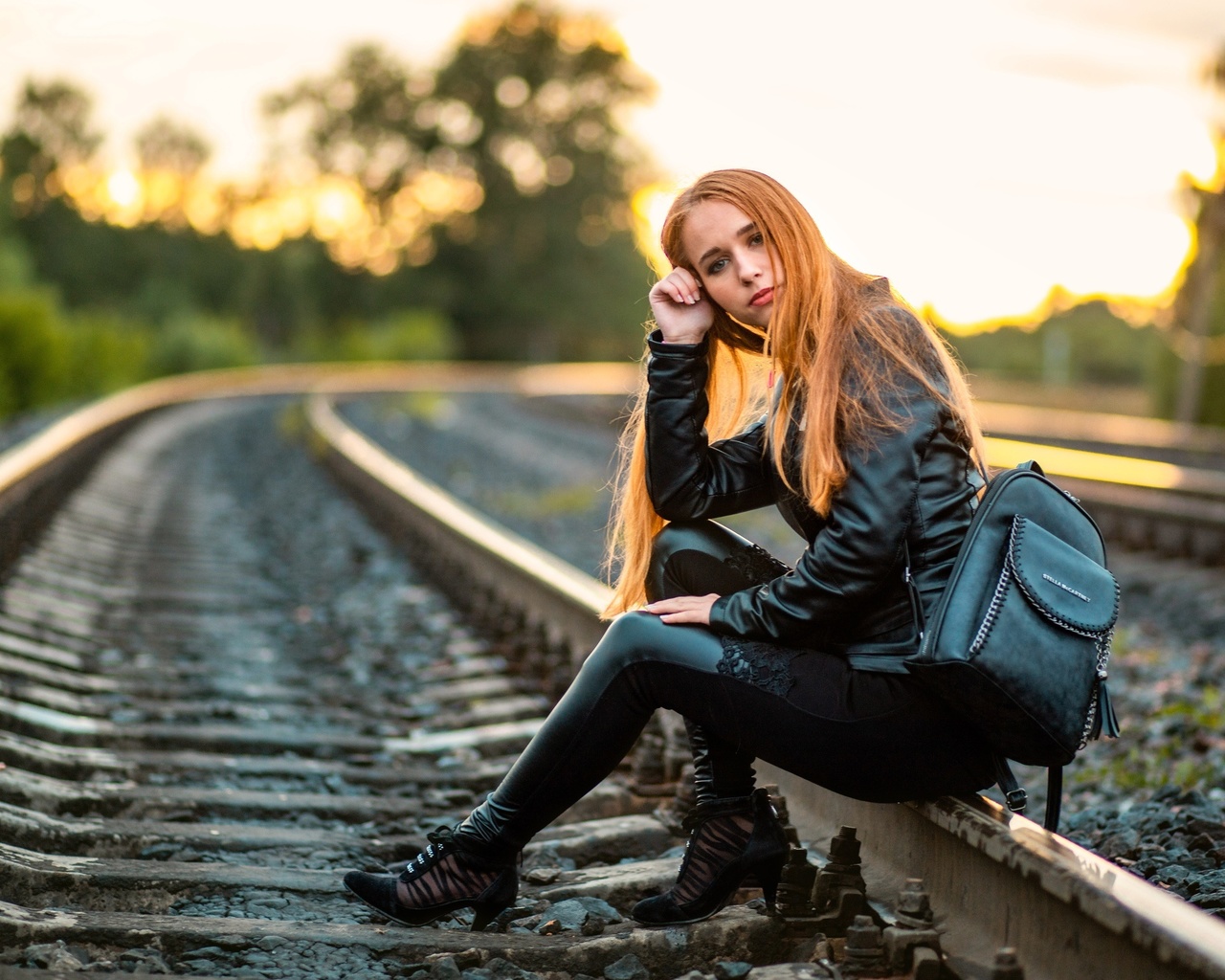 , railway, women, women outdoors, leather clothing, leather pants, leather jacket, trees, sky, backpack, redhead, nature, model, sitting, long hair