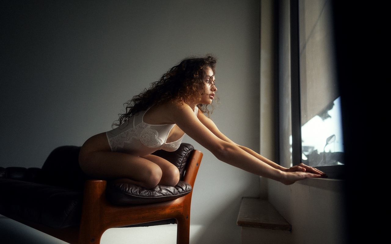 maxim gustarev, hips, , model, women indoors, white bodysuit, brunette, ass, couch, window, by the window