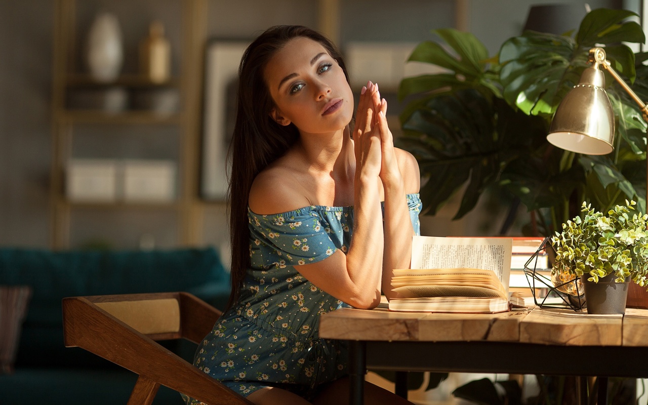 jumpsuit, brunette, sitting, , table, chair, plants, model, makeup, books, reading, looking at viewer, pink nails